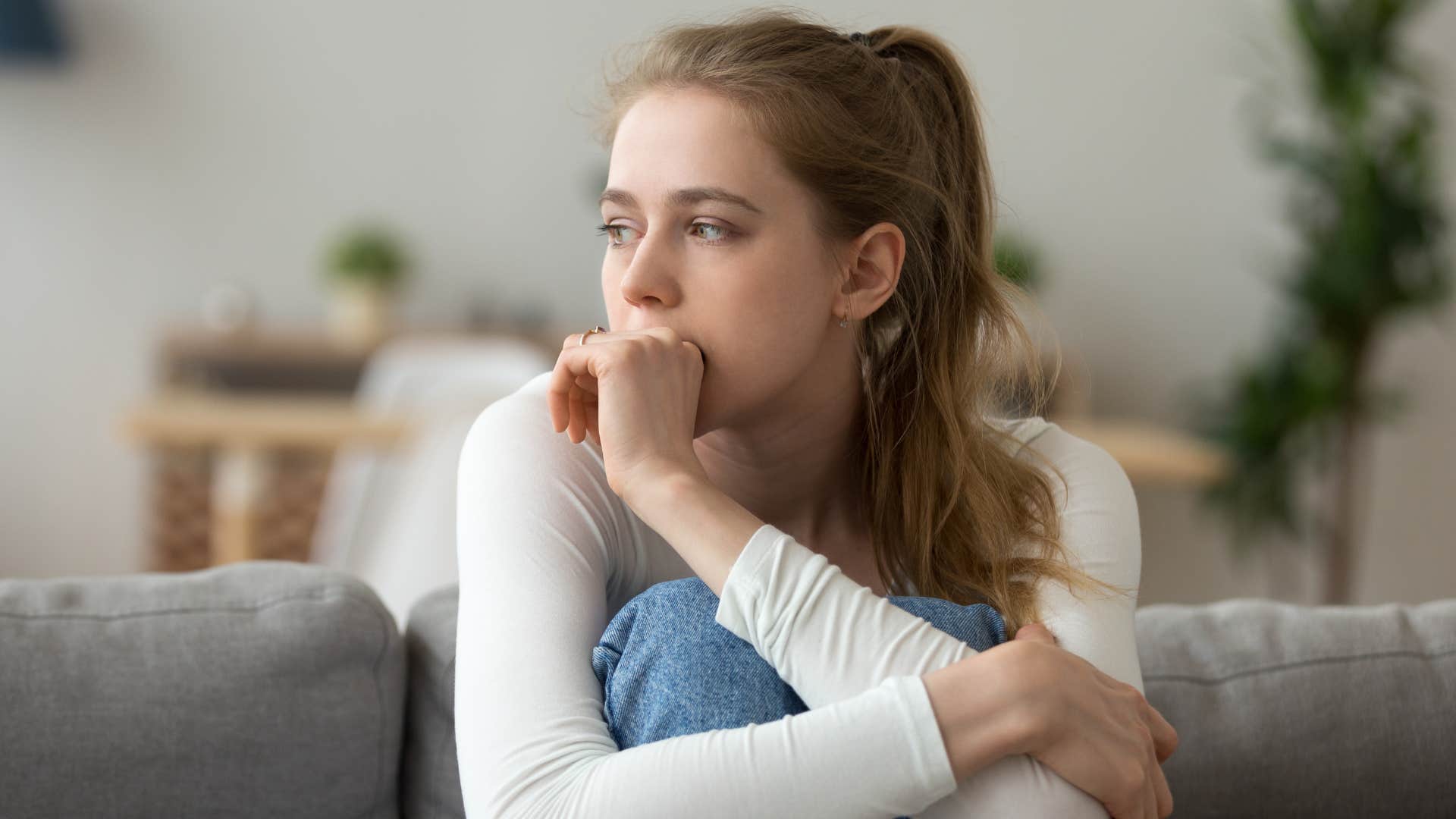 sad young woman looking distraught feeling inauthentic
