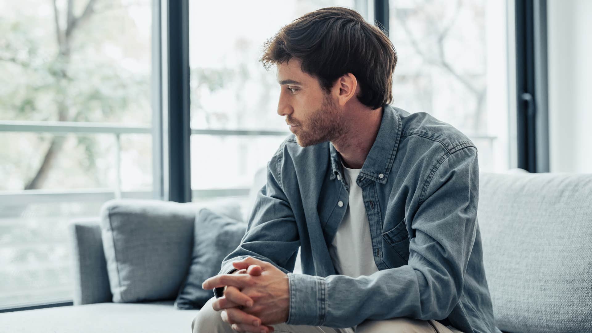 man unable to picture a life with his partner looking sad