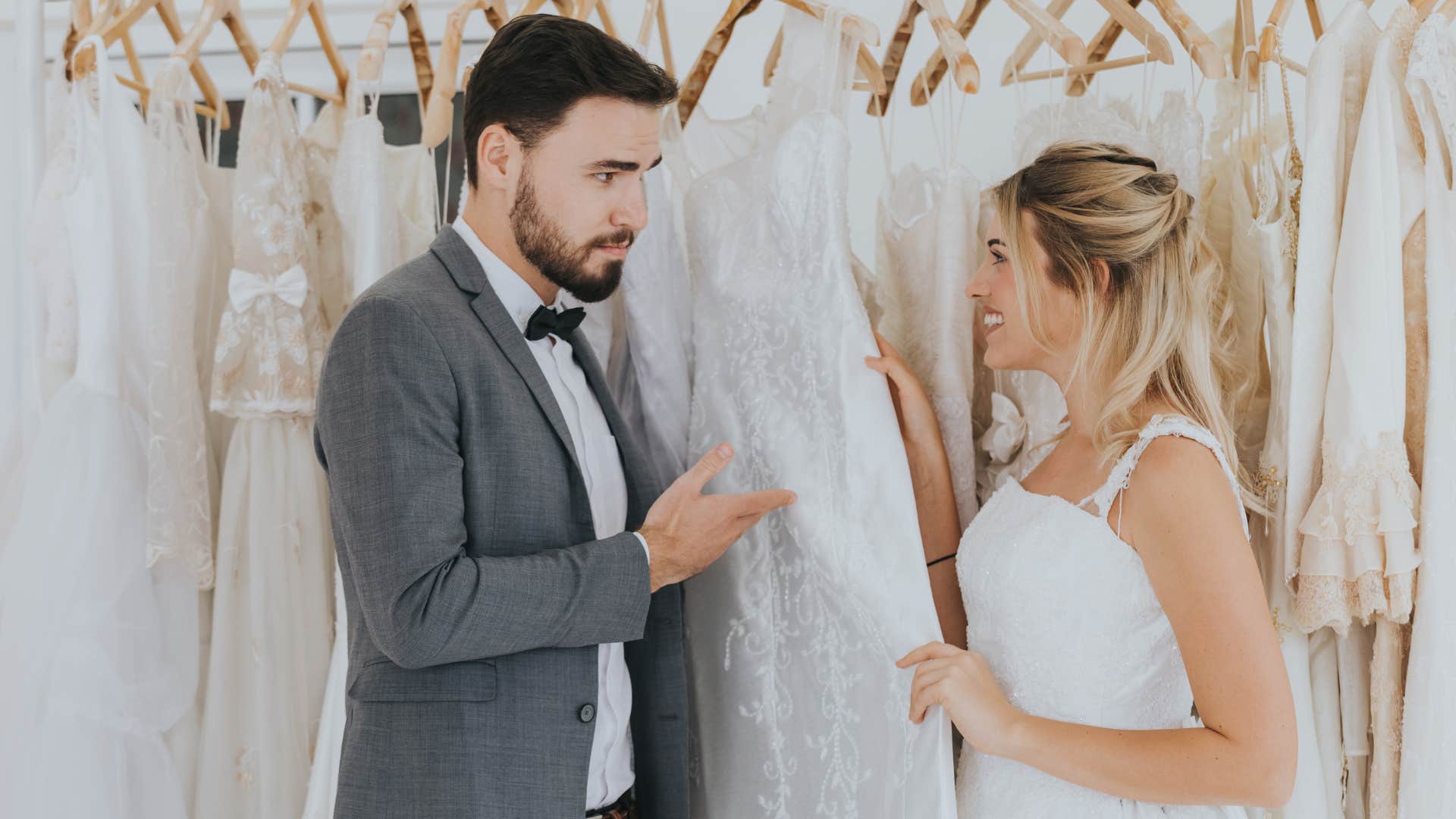 a man makes his intentions clear that he wants to marry his girlfriend as they pick out her wedding dress