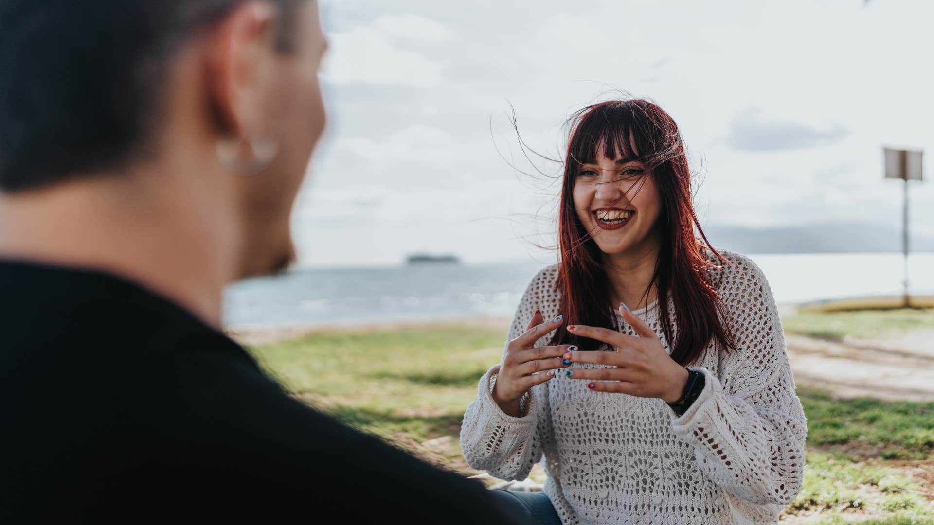 a man takes his girlfriend by the sea because it makes her happy to be there