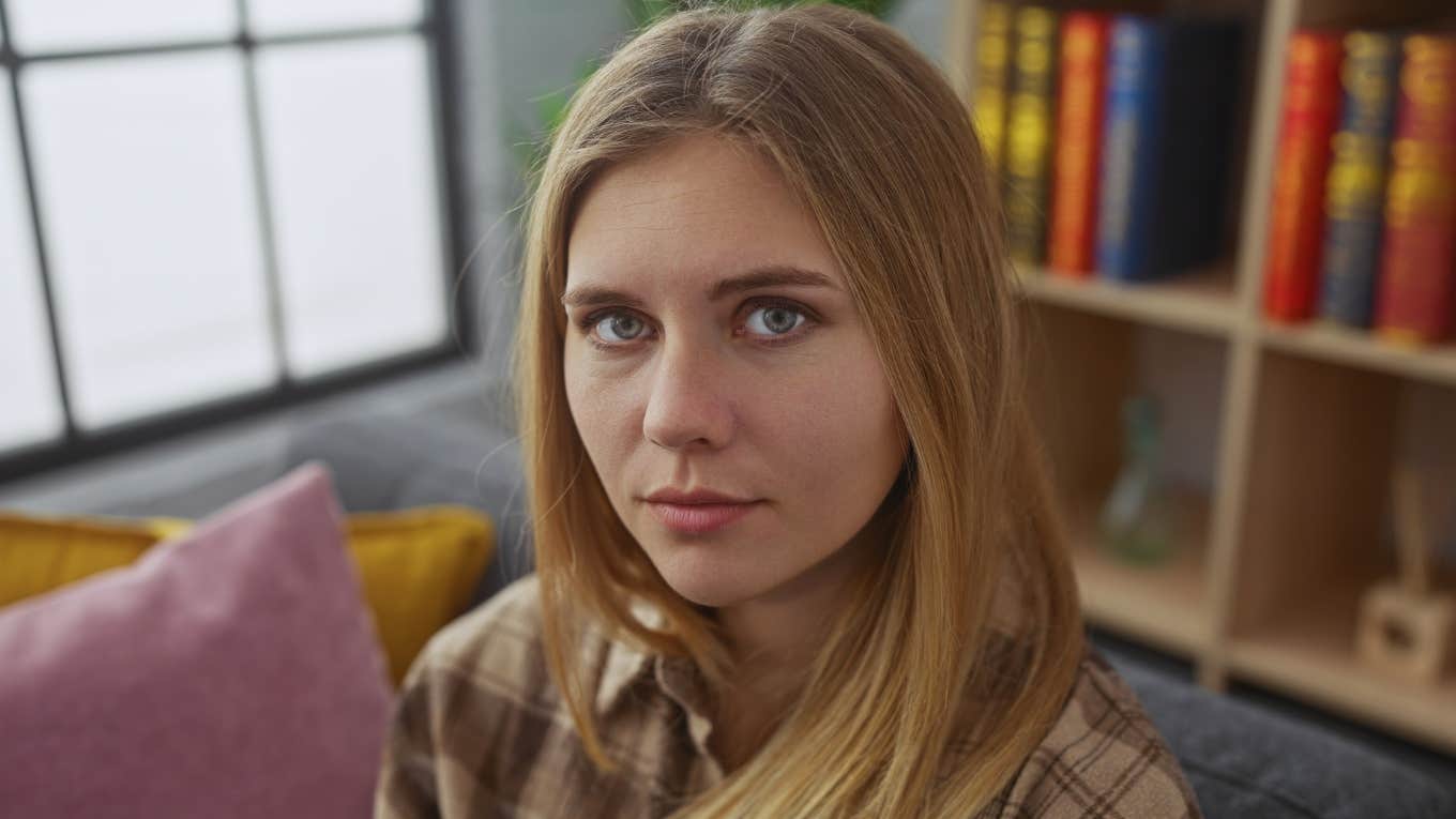 Signs You Grew Up With Lazy Parents In A Messy House And It Still Affects You Today, According To Psychology sad woman trying to think among messy home