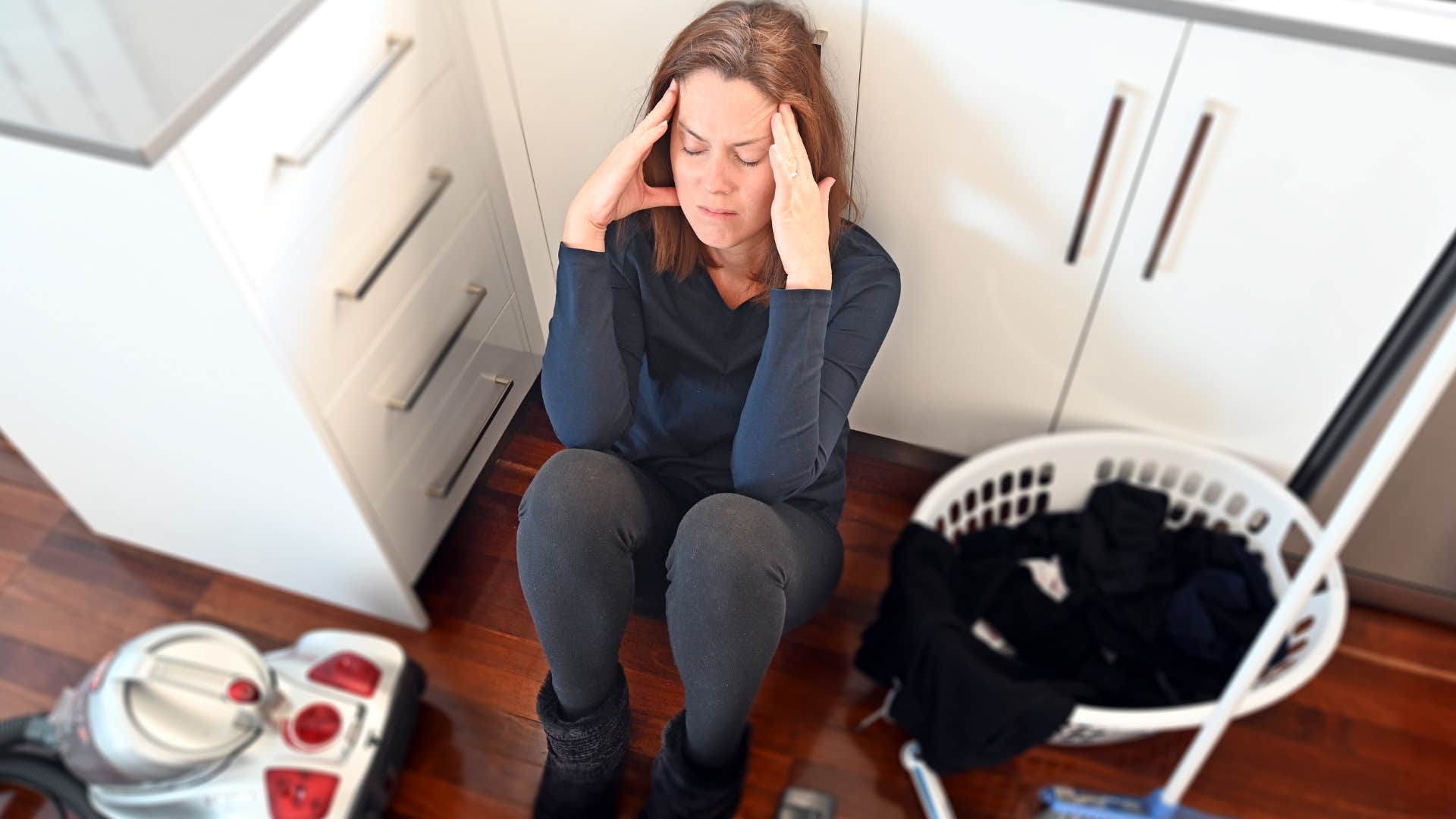 woman ignoring chores looking stressed