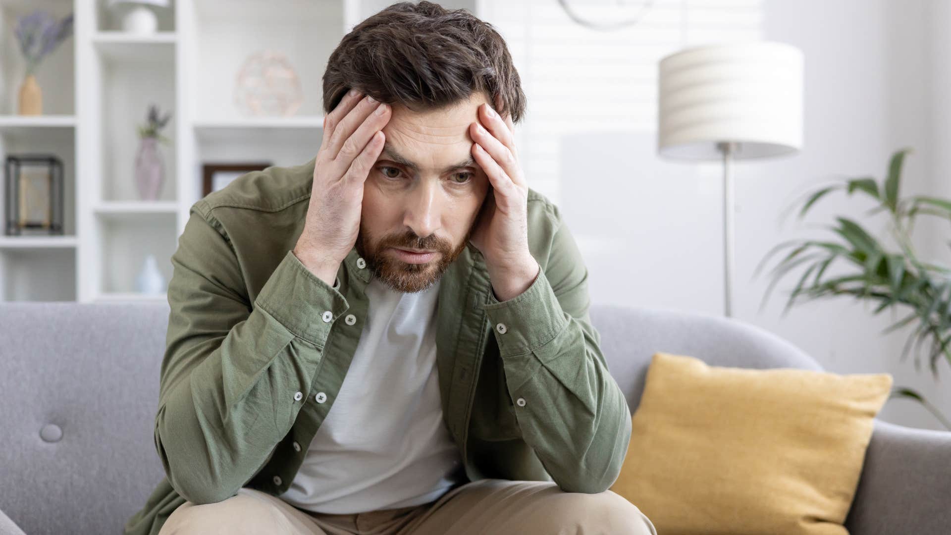man scared of being seen as lazy looking stressed
