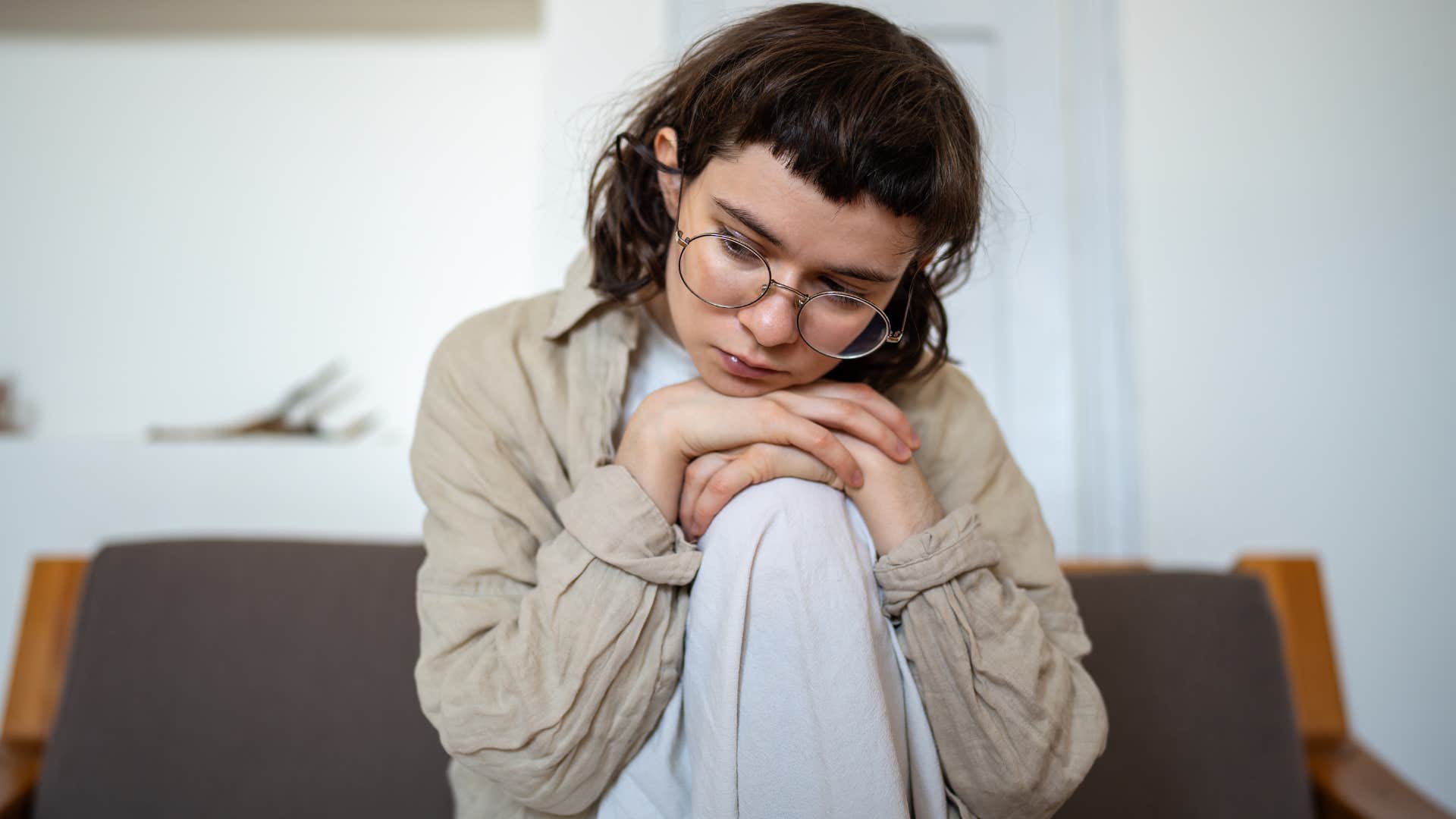 woman feeling ashamed of the space she lives in