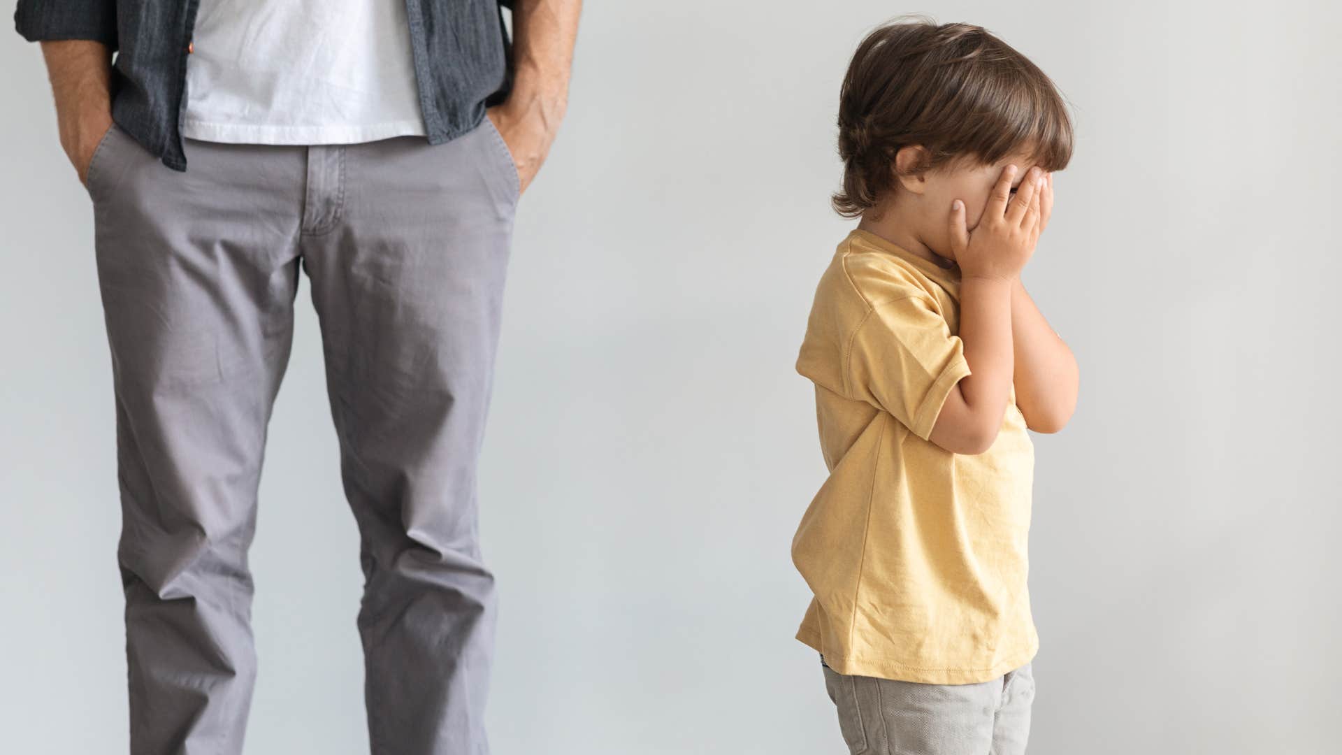 a young boy cries because his father refuses to tell him he loves him