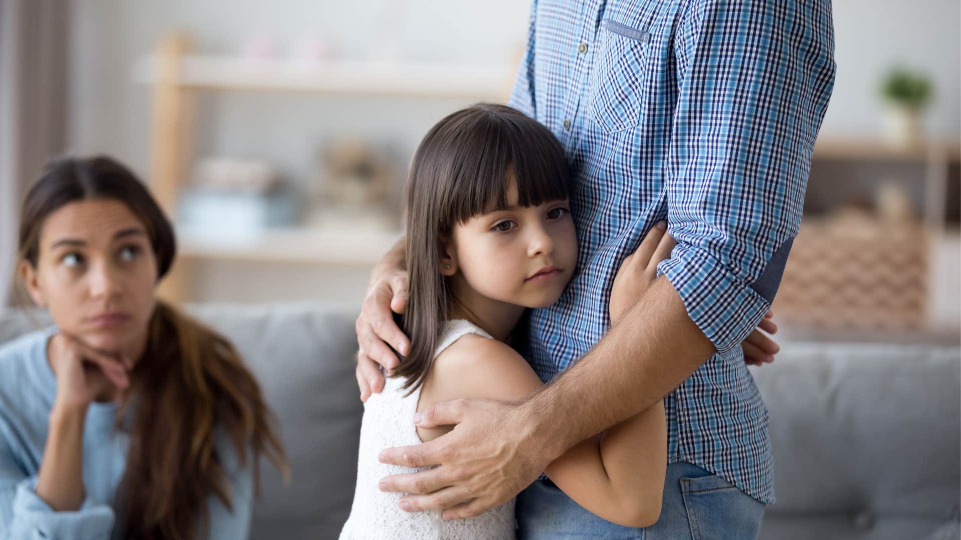 a young girl sees her father for the first time in weeks