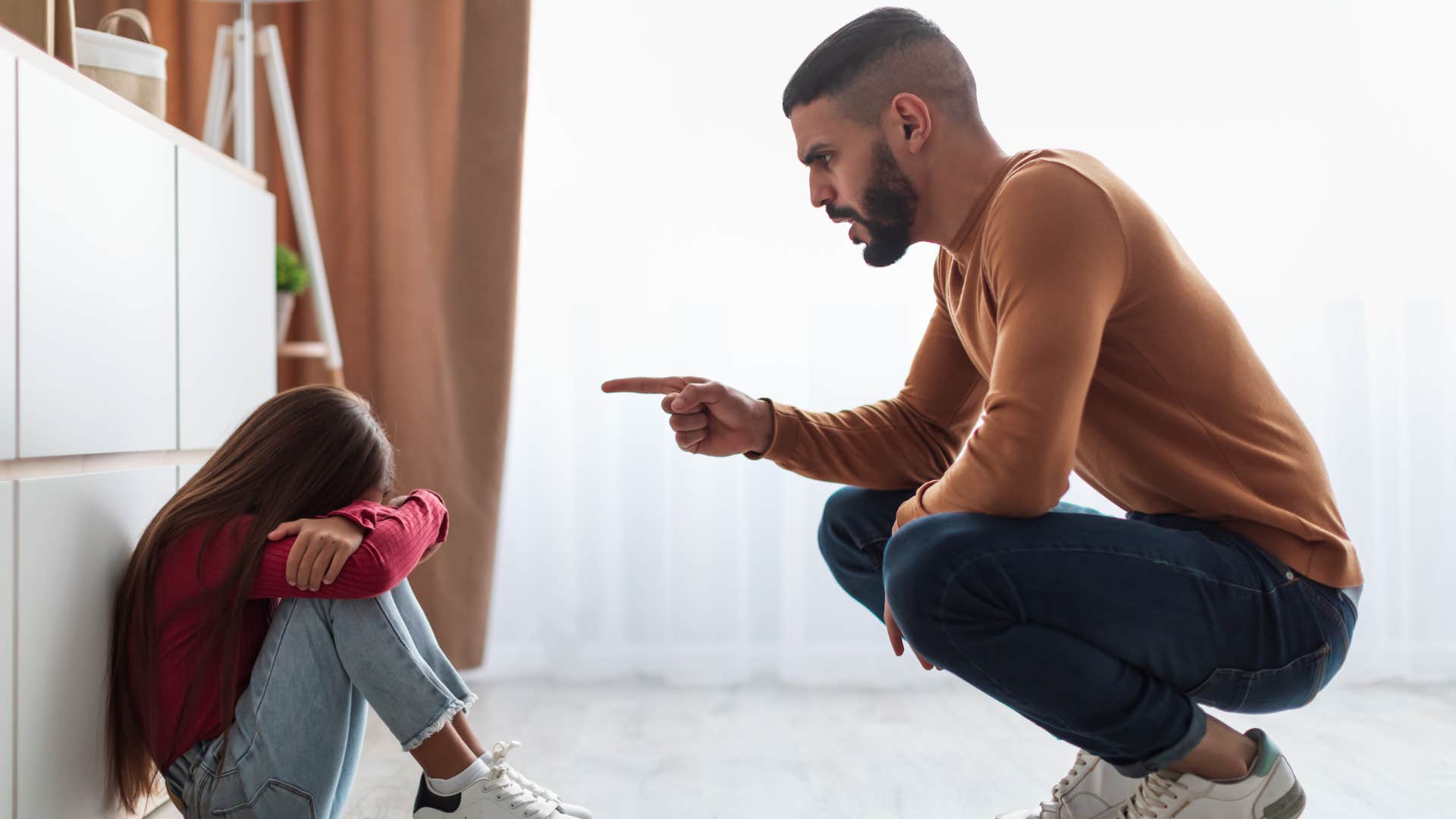 a father scolds his daughter for always getting in the way of his hobbies