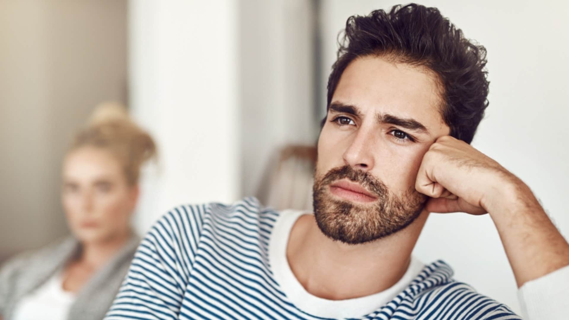conflicted man feeling guilty for saying no to girlfriend 