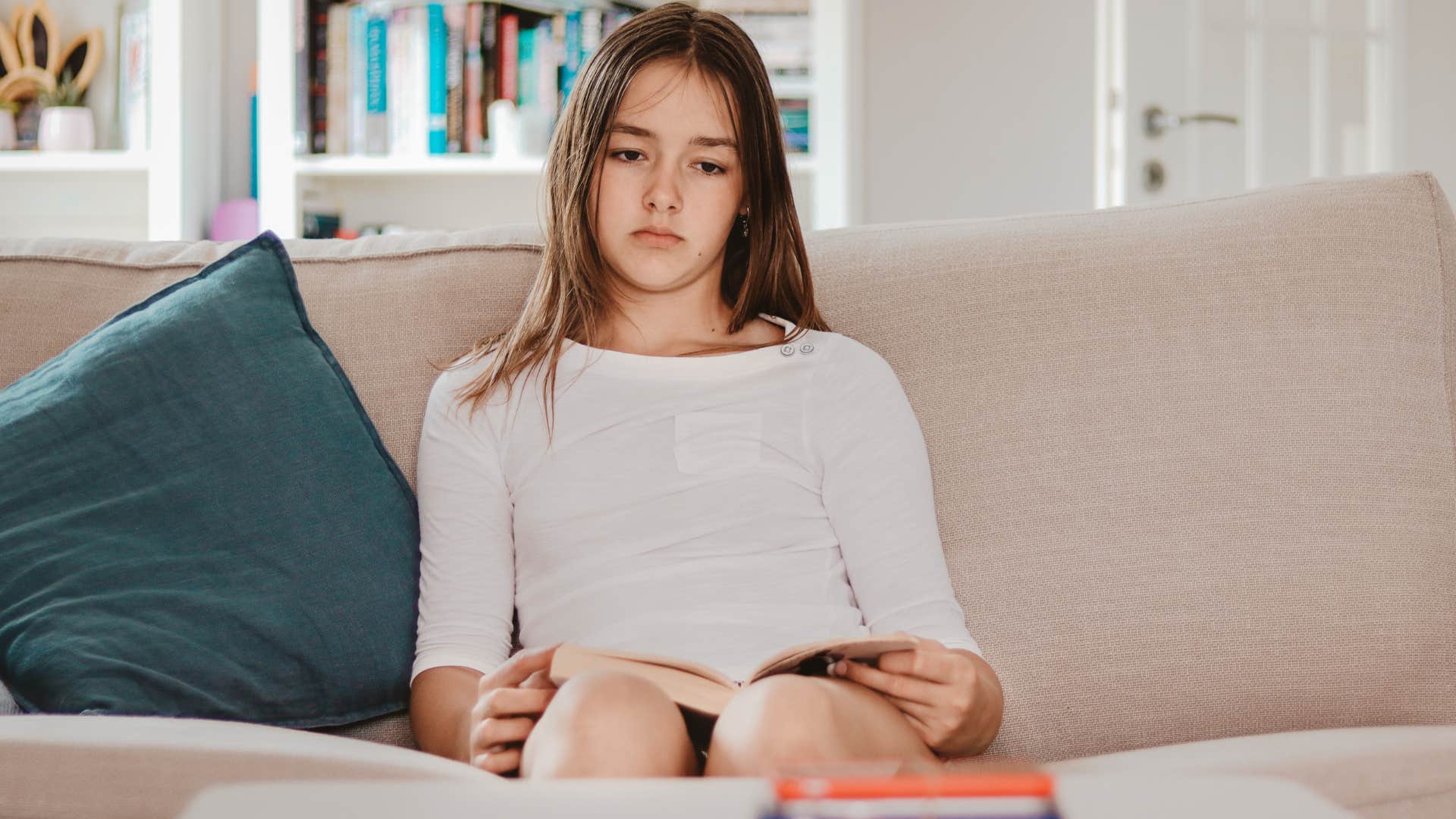 Upset young girl whose success was hardly celebrated by family.