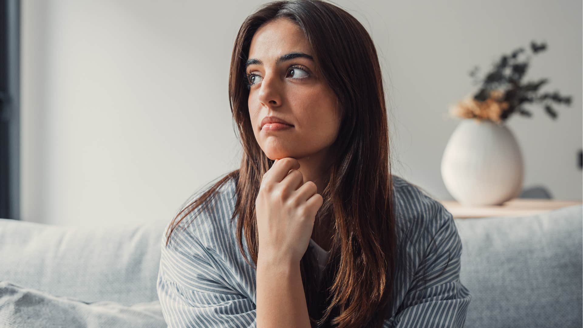 Woman who follows your inner voice looking away from the camera.