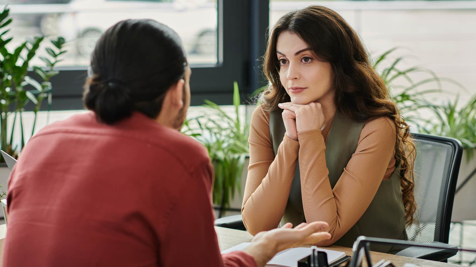 Woman who listens more than you speak looking at a friend.