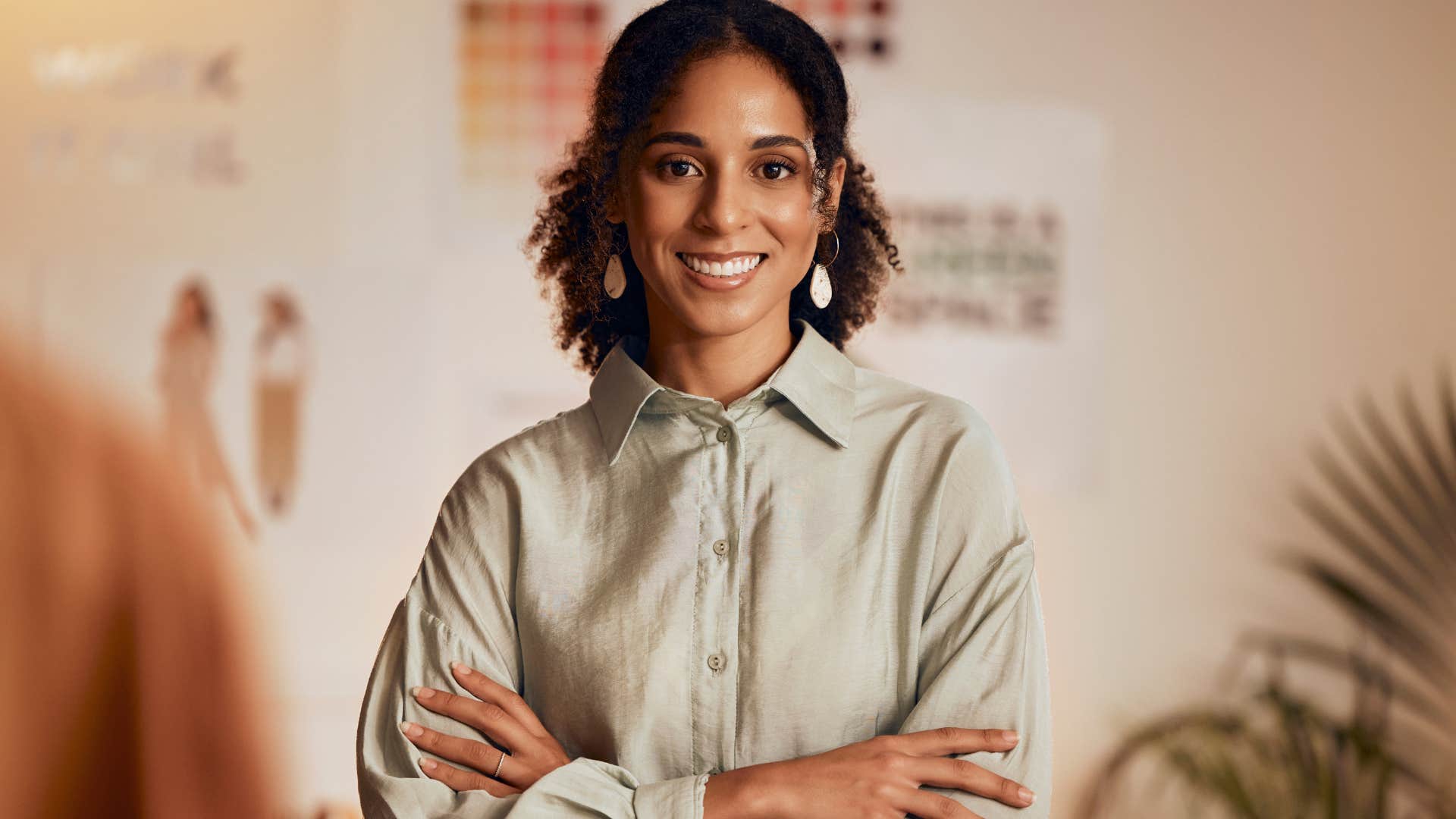 Woman with a strong sense of personal style smiling at the camera.
