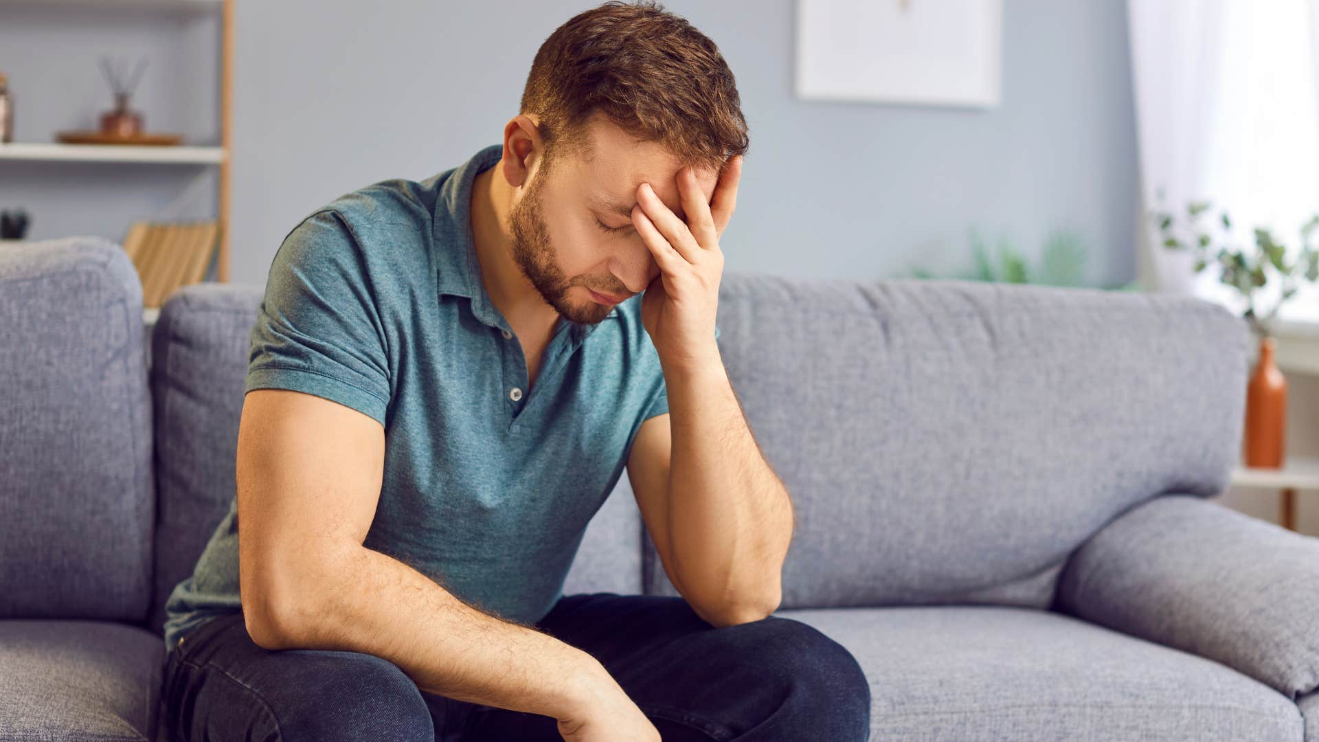 man who feels like hes too much holding his head