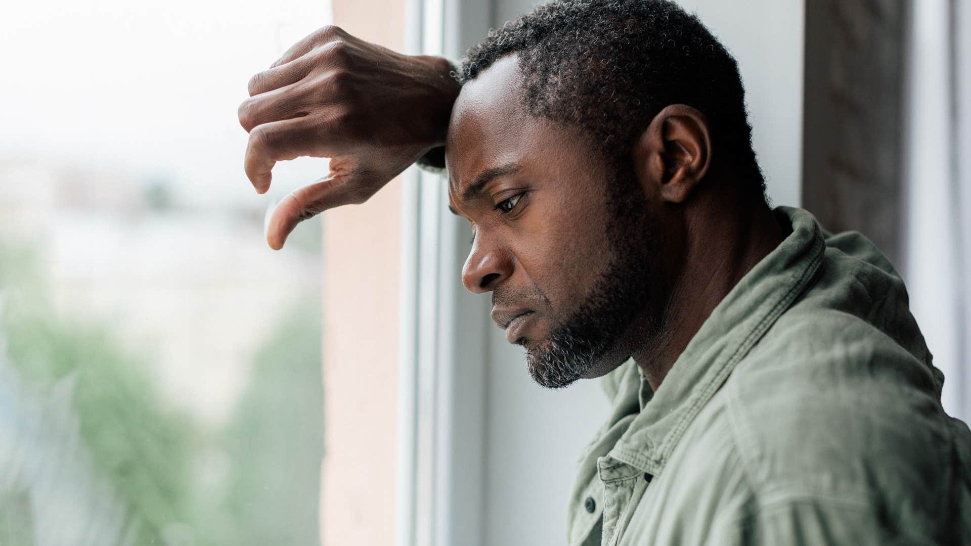 sad man who doesn't feel like himself feeling insane