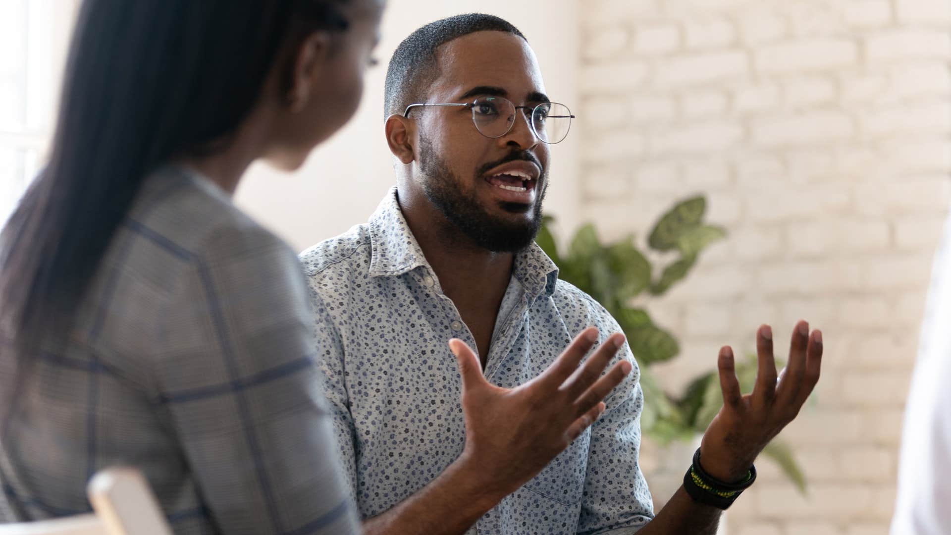 man over-explaining himself talking to toxic peers