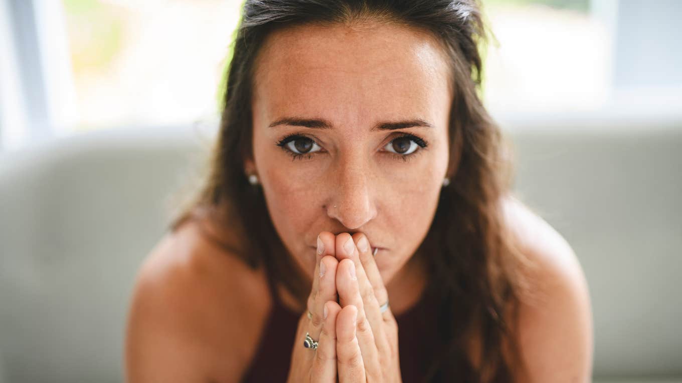 Signs You're Not Crazy, It's People Around You That Make You Feel Insane stressed woman praying after being made to feel insane