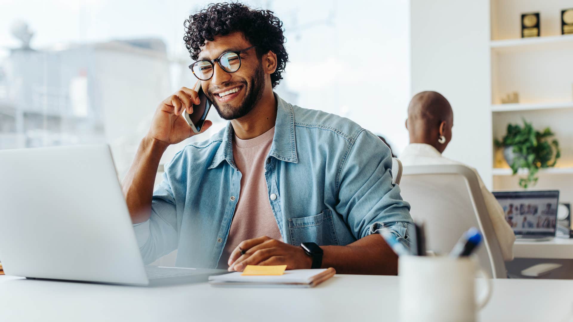 man a part of the xennial generation having a phone conversation