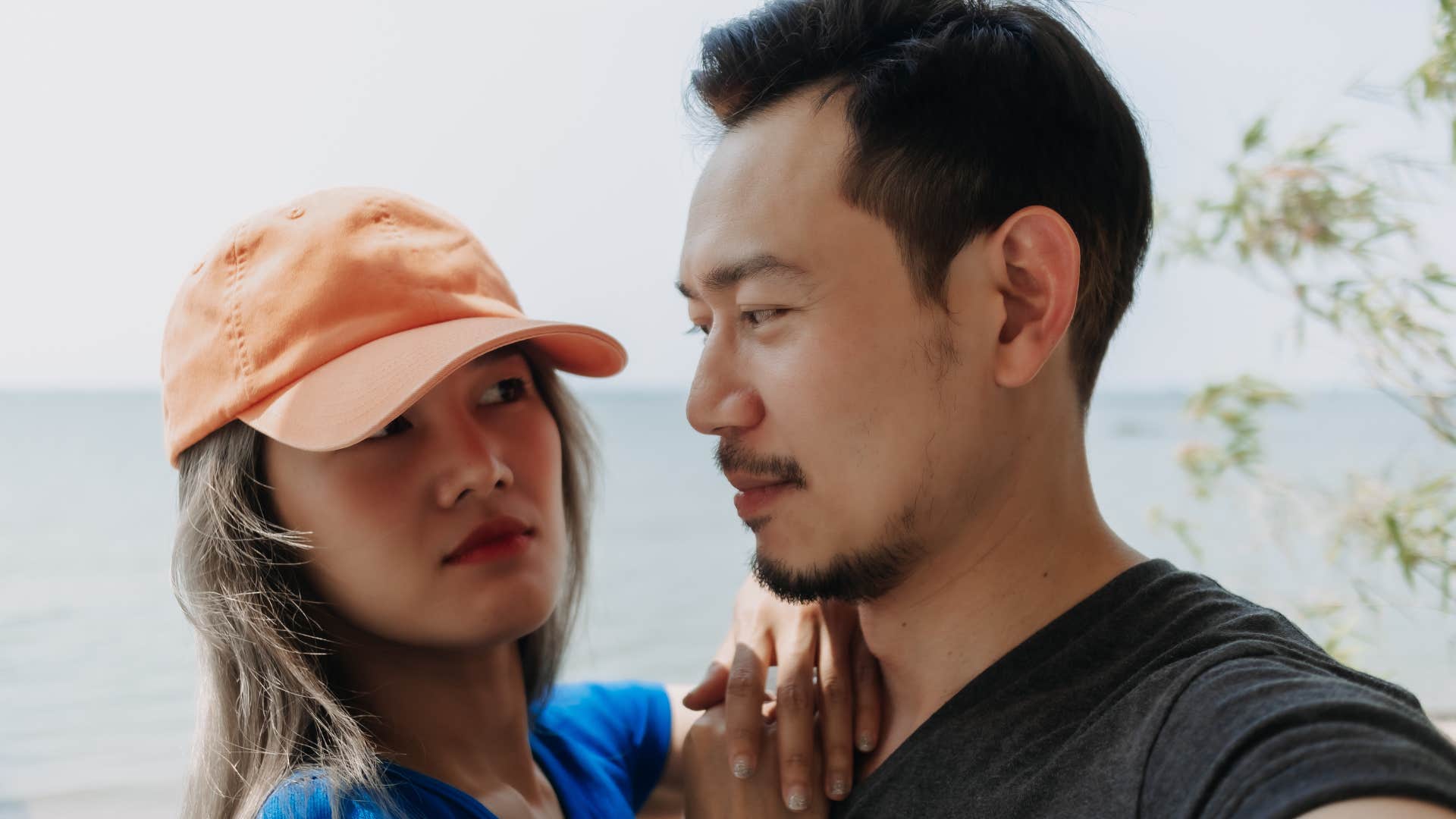 a wife looks at her husband telling him no and he accepts it