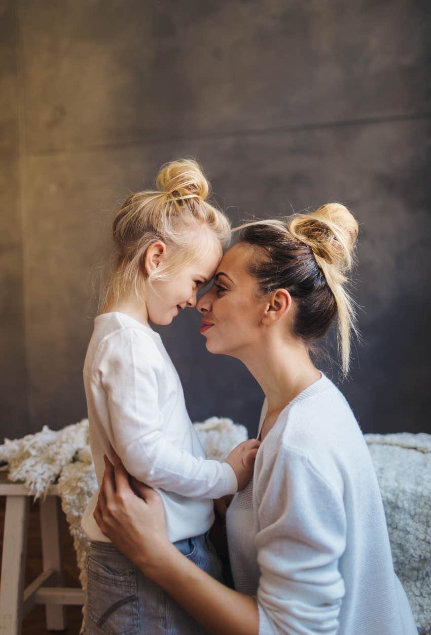 Mom comforting daughter since their father left them