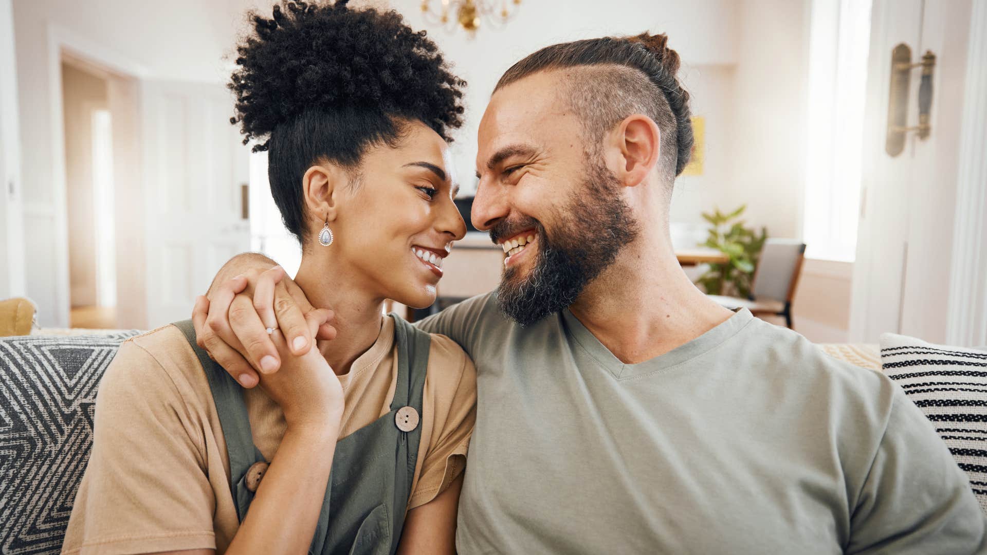 Woman who is open with her vulnerability smiling at her partner.