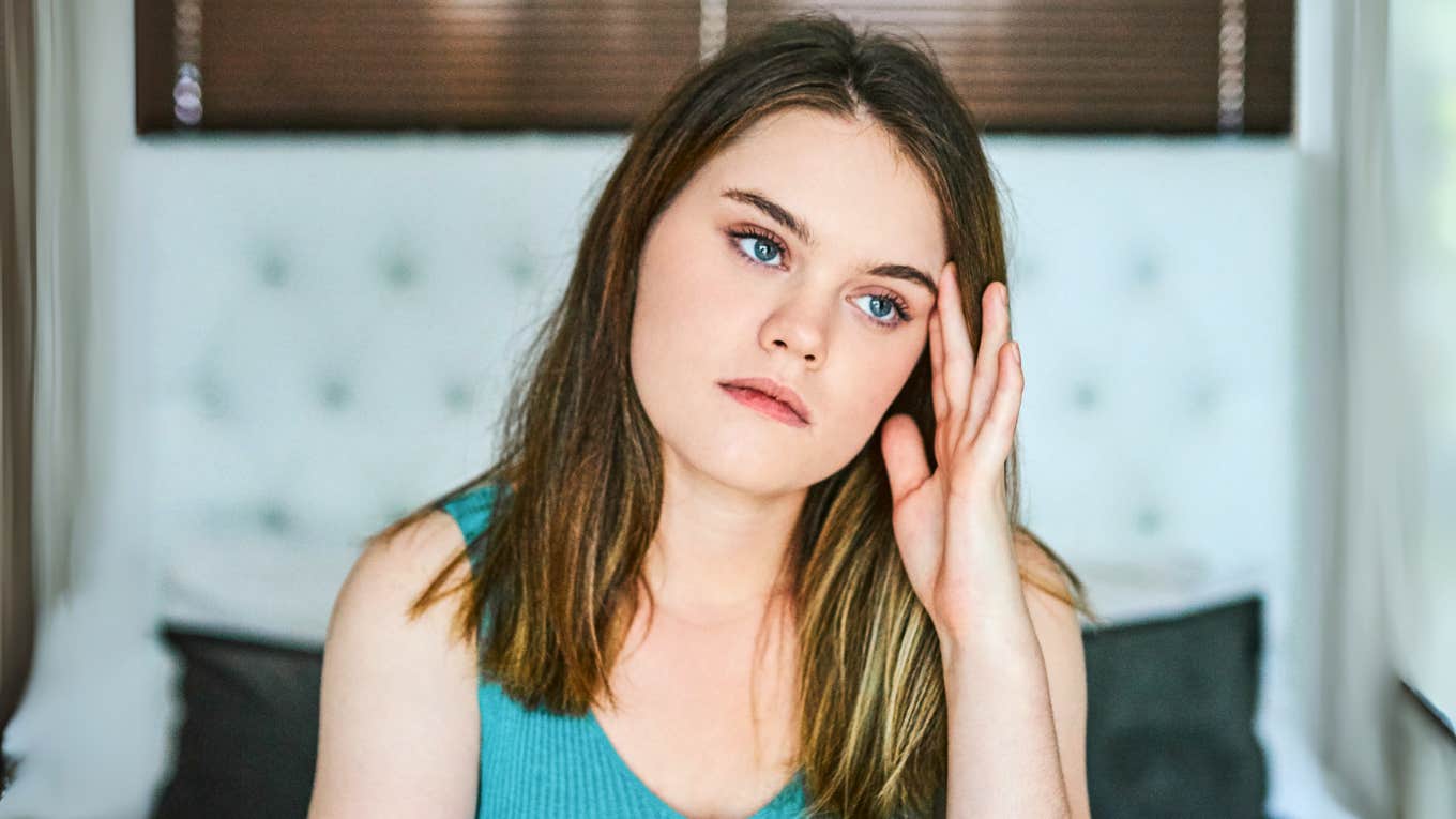 Small Habits People Use To Break Free From People-Pleasing, According To Psychology People pleaser in her head, trying to break free.