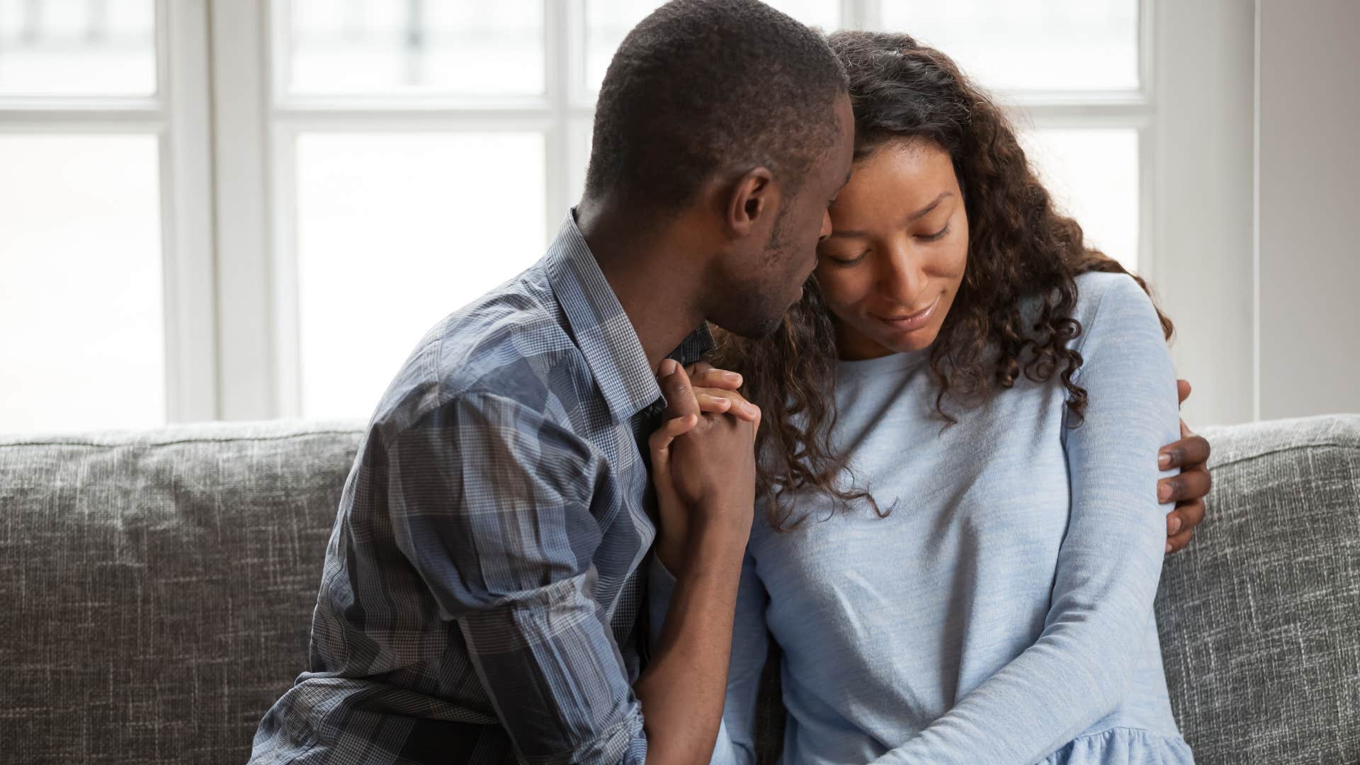woman hugging her partner after asking for help