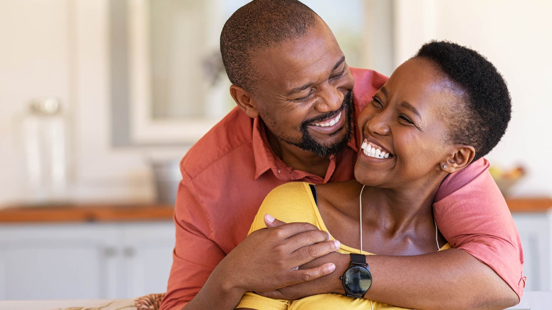woman celebrating her partner's wins hugging him