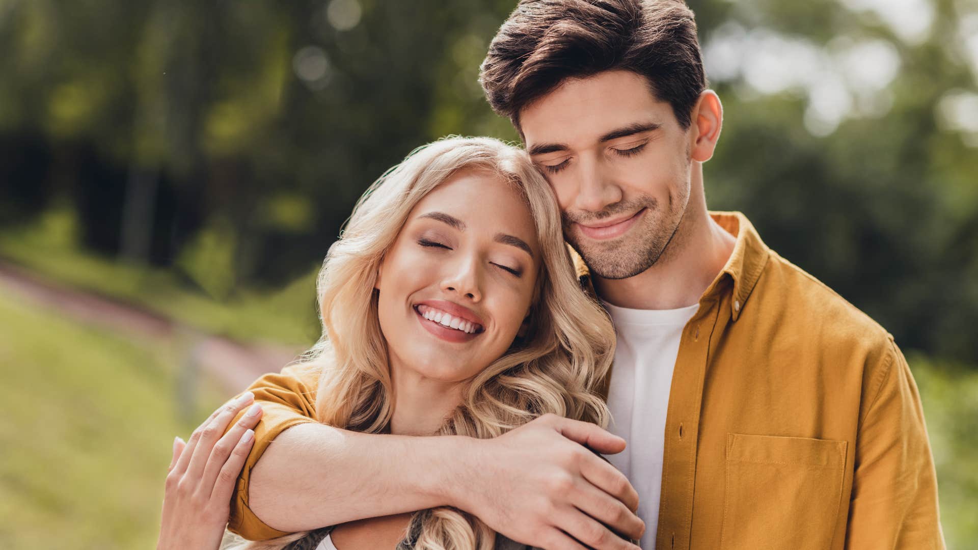 couple in love hugging each other standing outside