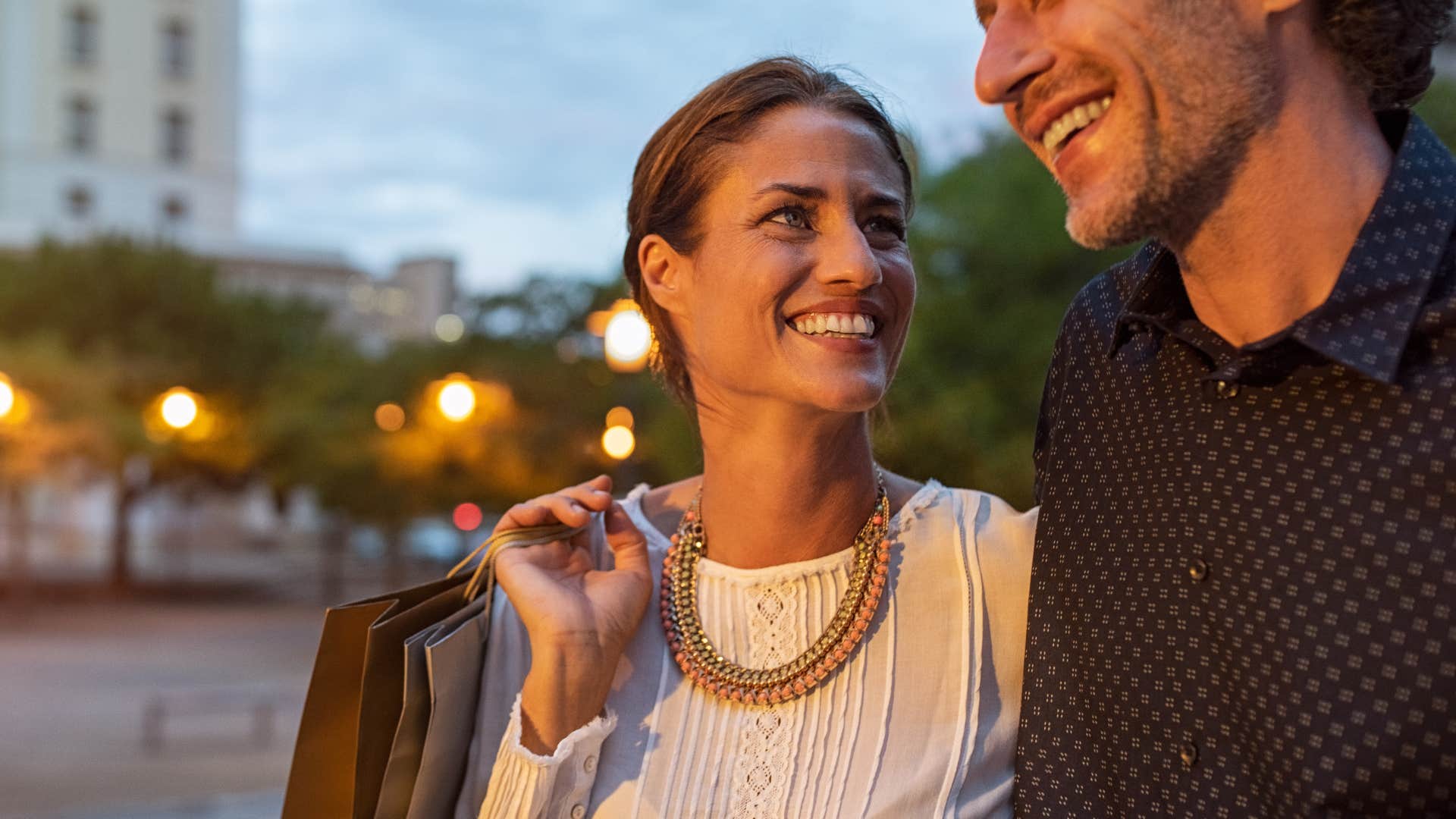 woman looking at man as they travel around