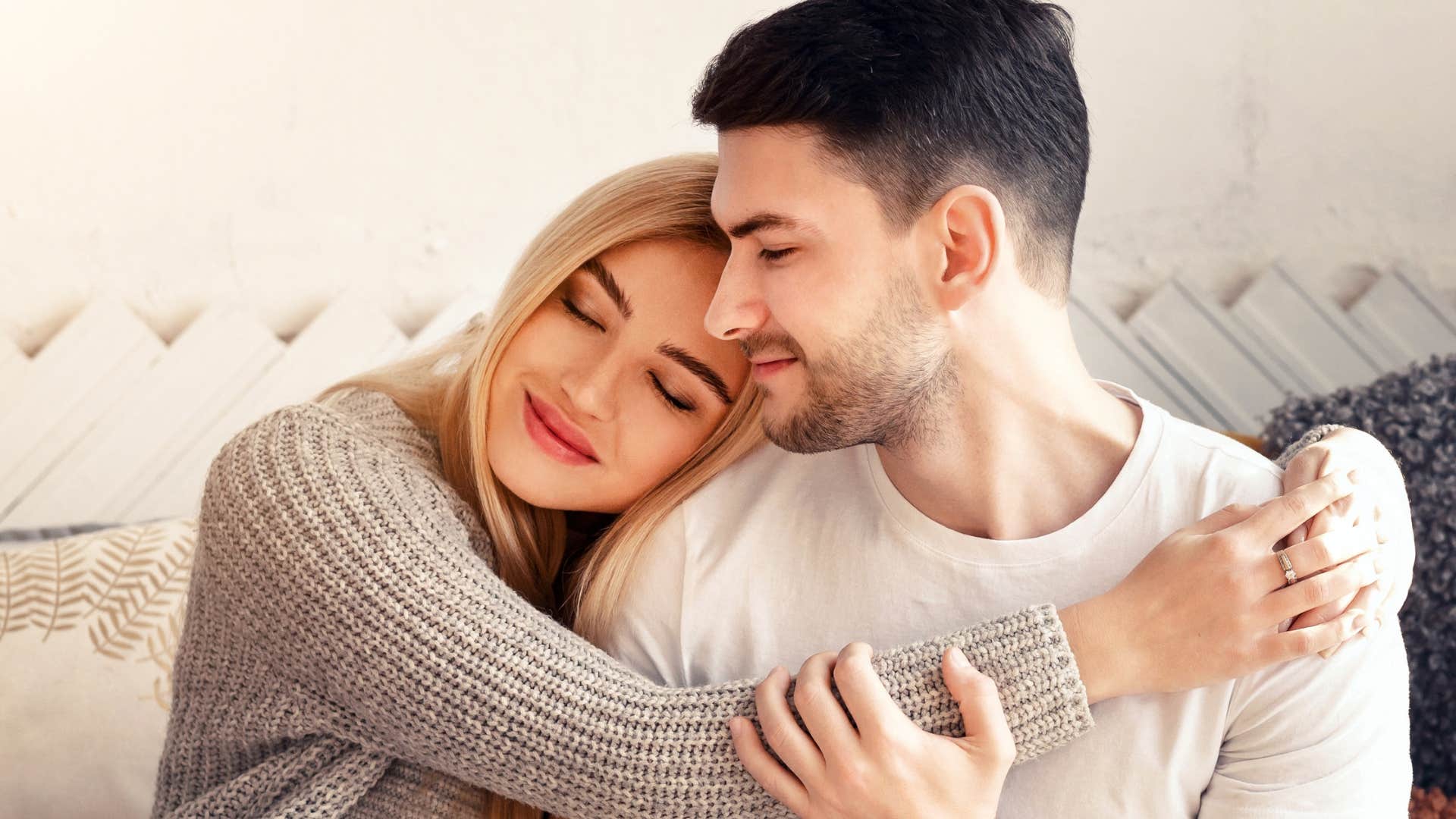 woman comforting partner who doesnt feel well