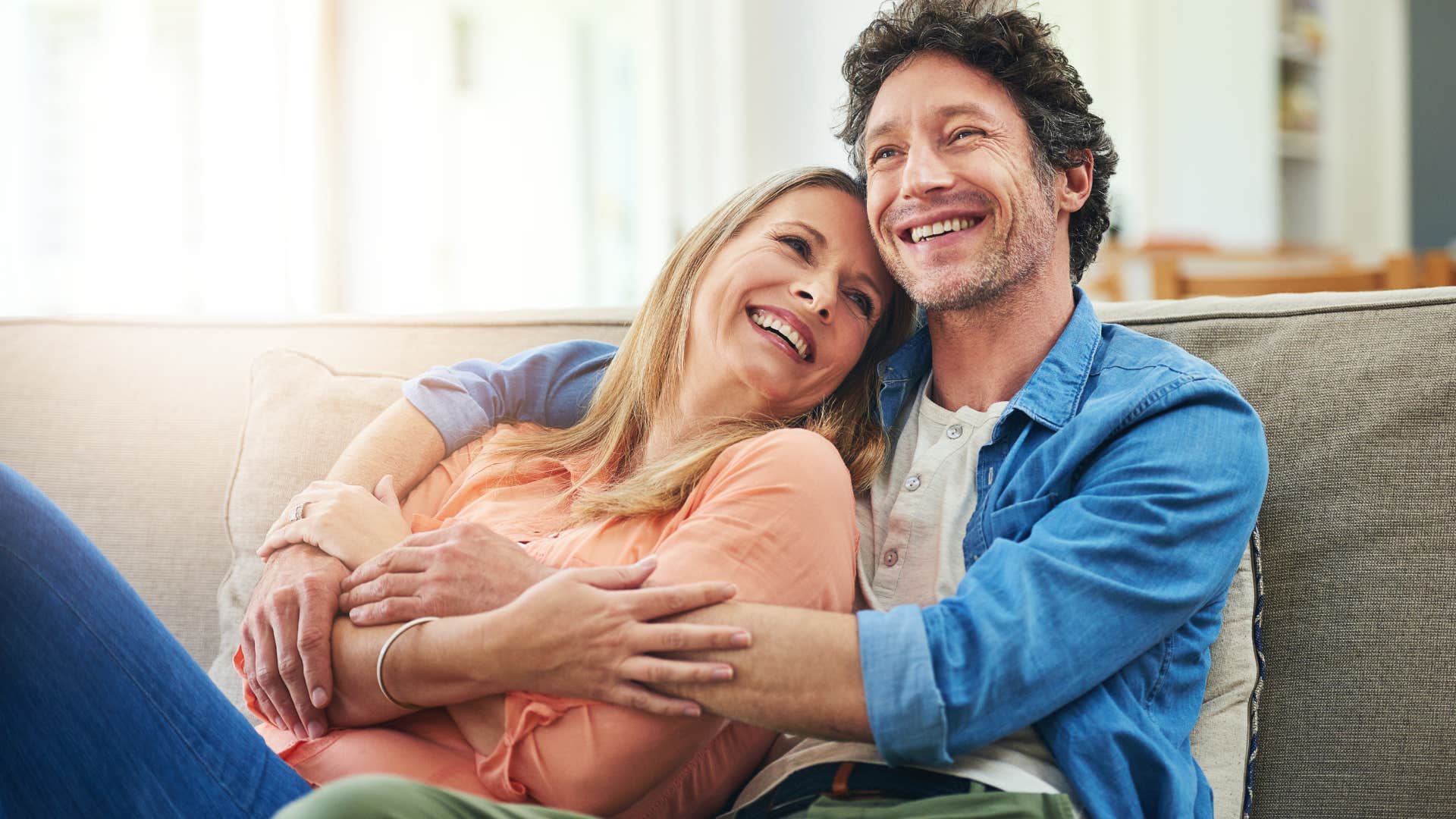 woman laying her head on man's chest to drive him insane