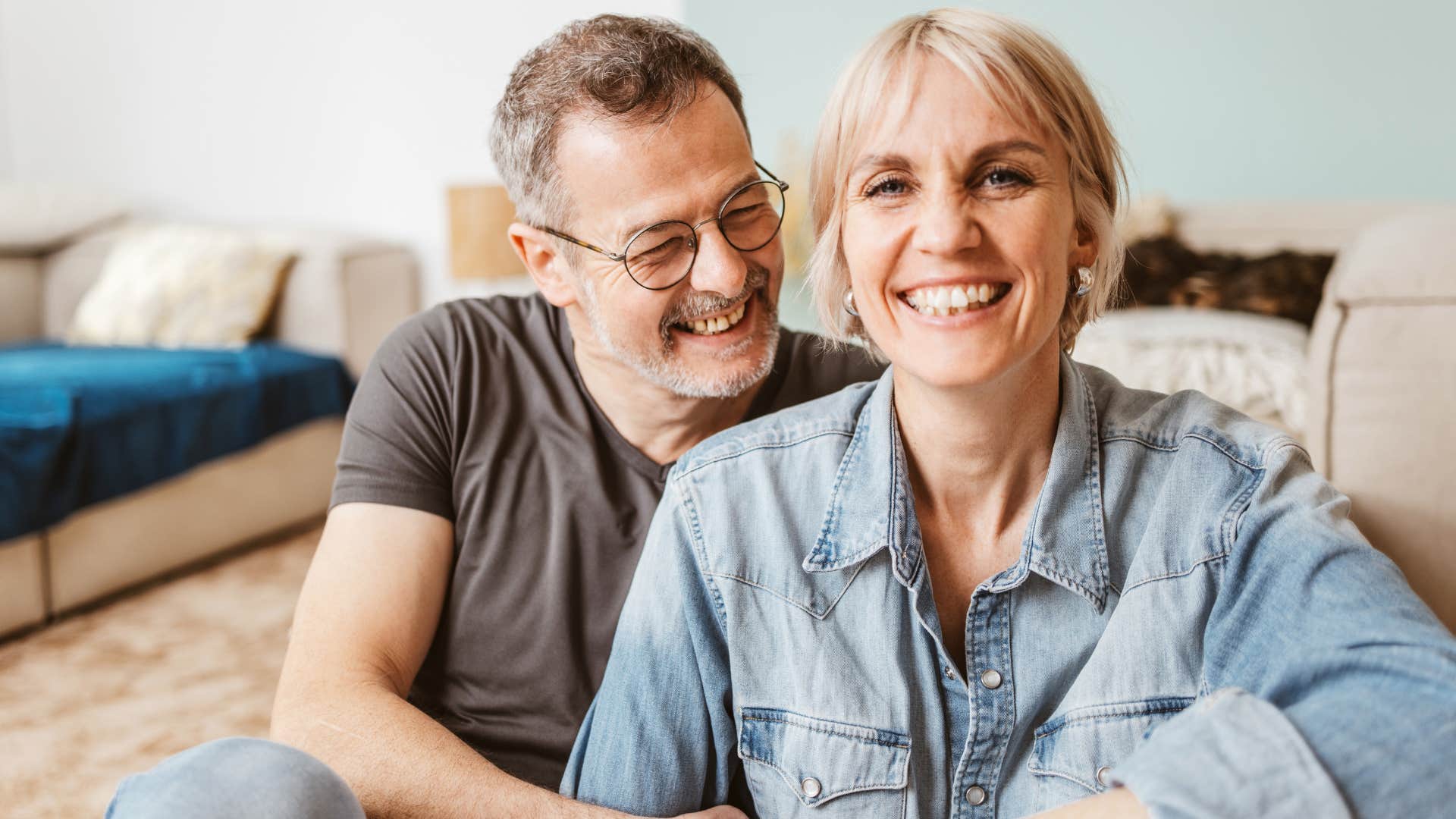 man and woman with great emotional intimacy smiling next to each other