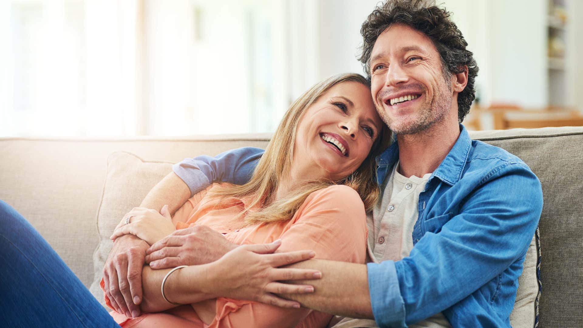man prioritizing honesty and hugging his partner