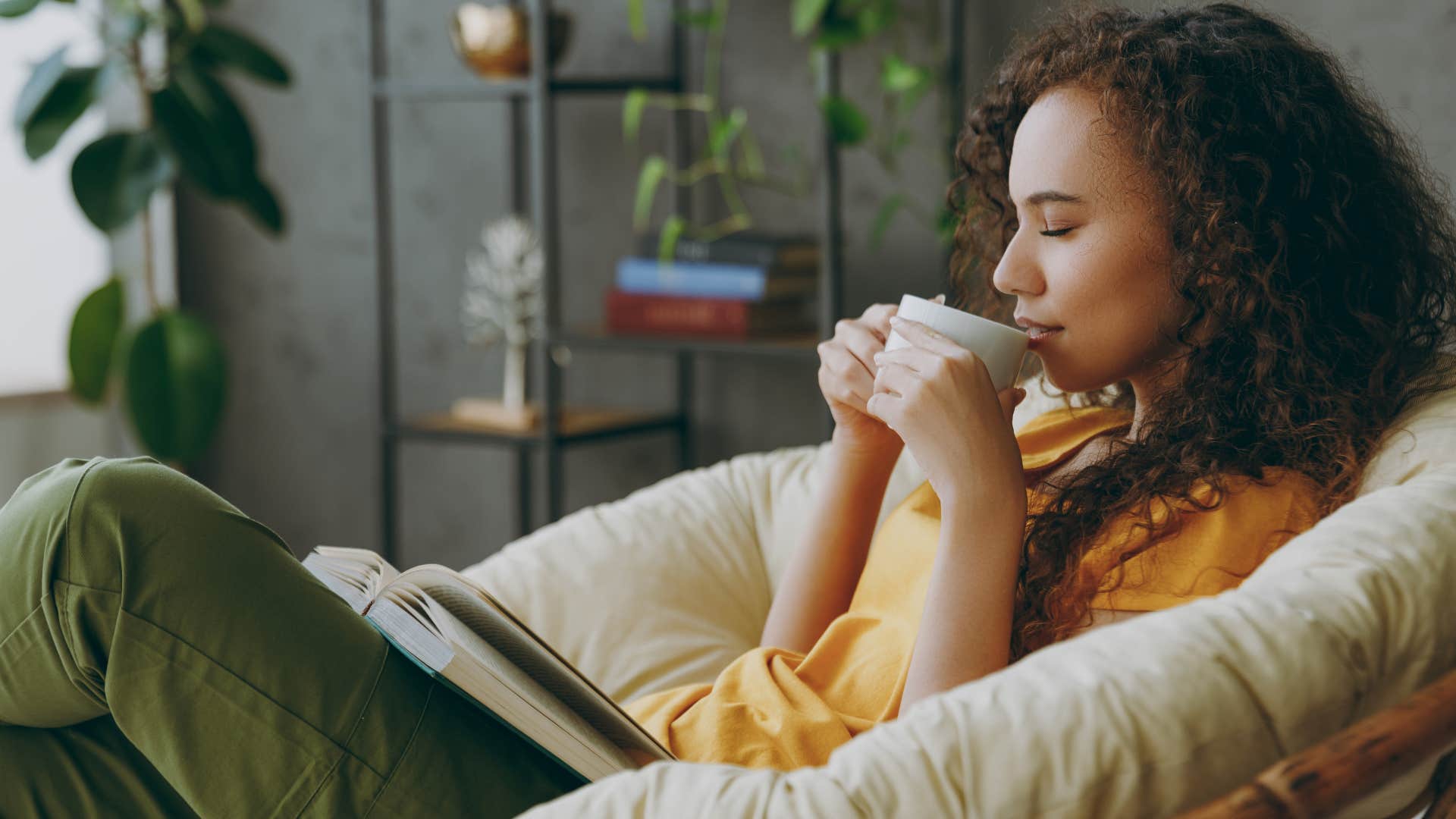 content woman sipping tea slowly