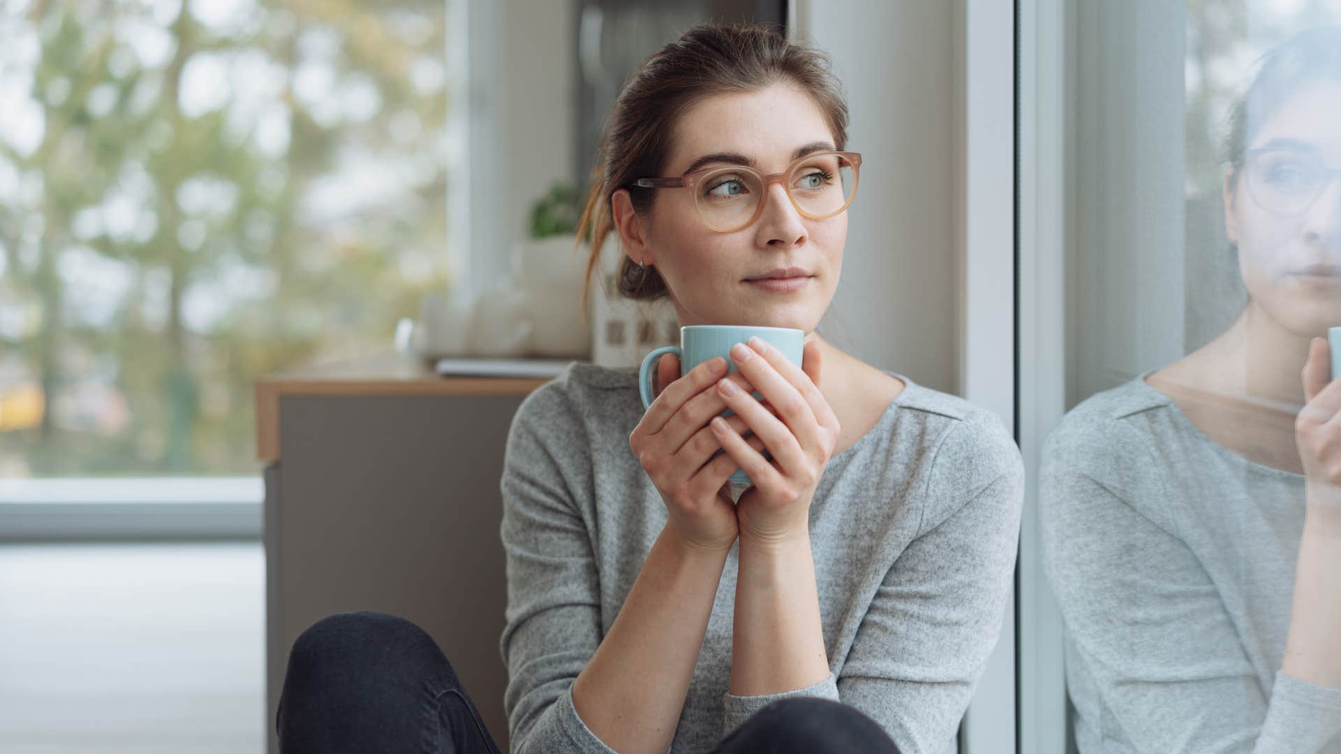 a woman honors her boundaries and stays at home not feeling bad about it