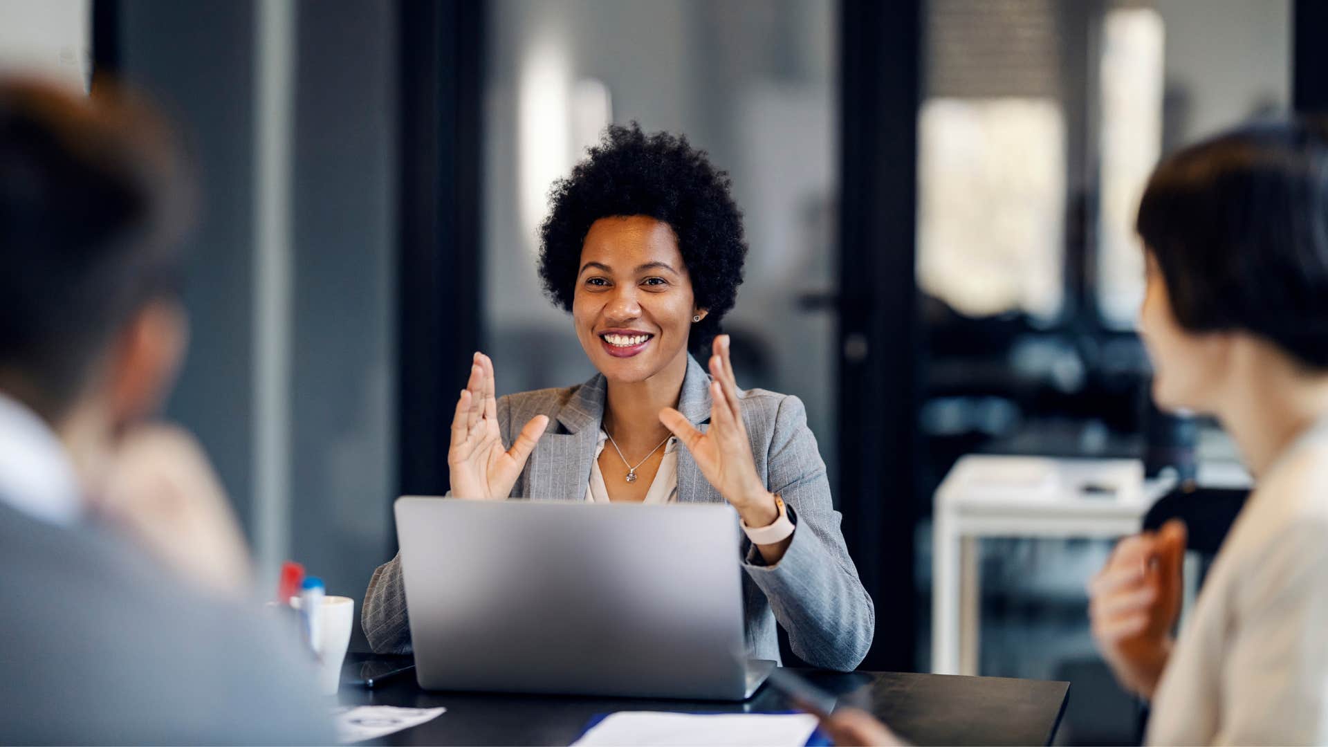 a woman stops apologizing in meetings before speaking regaining her confidence