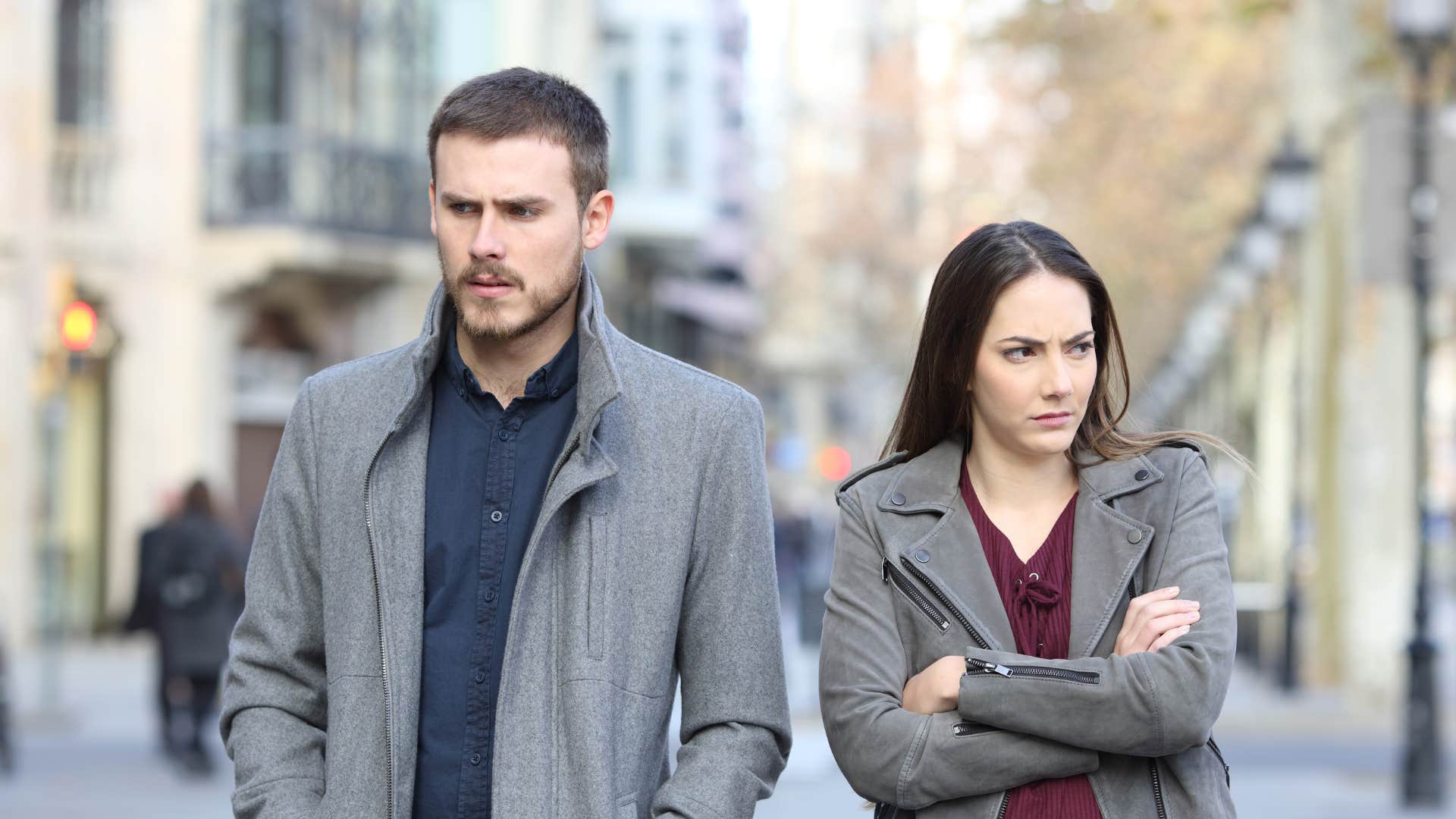 a woman walks away from her boyfriend because he drains her energy
