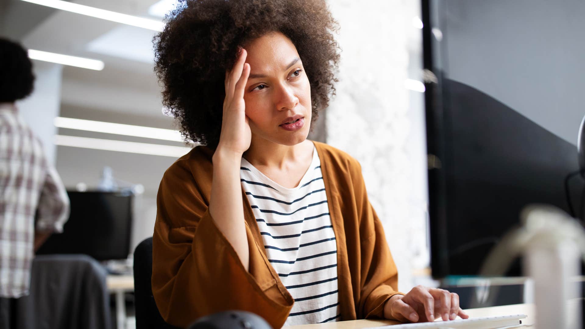 unmotivated woman stressed out at work