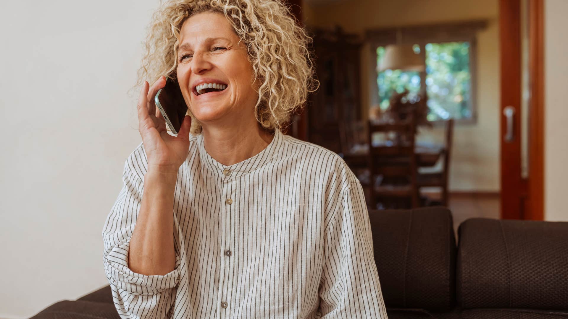 woman who is a people-pleaser on the phone