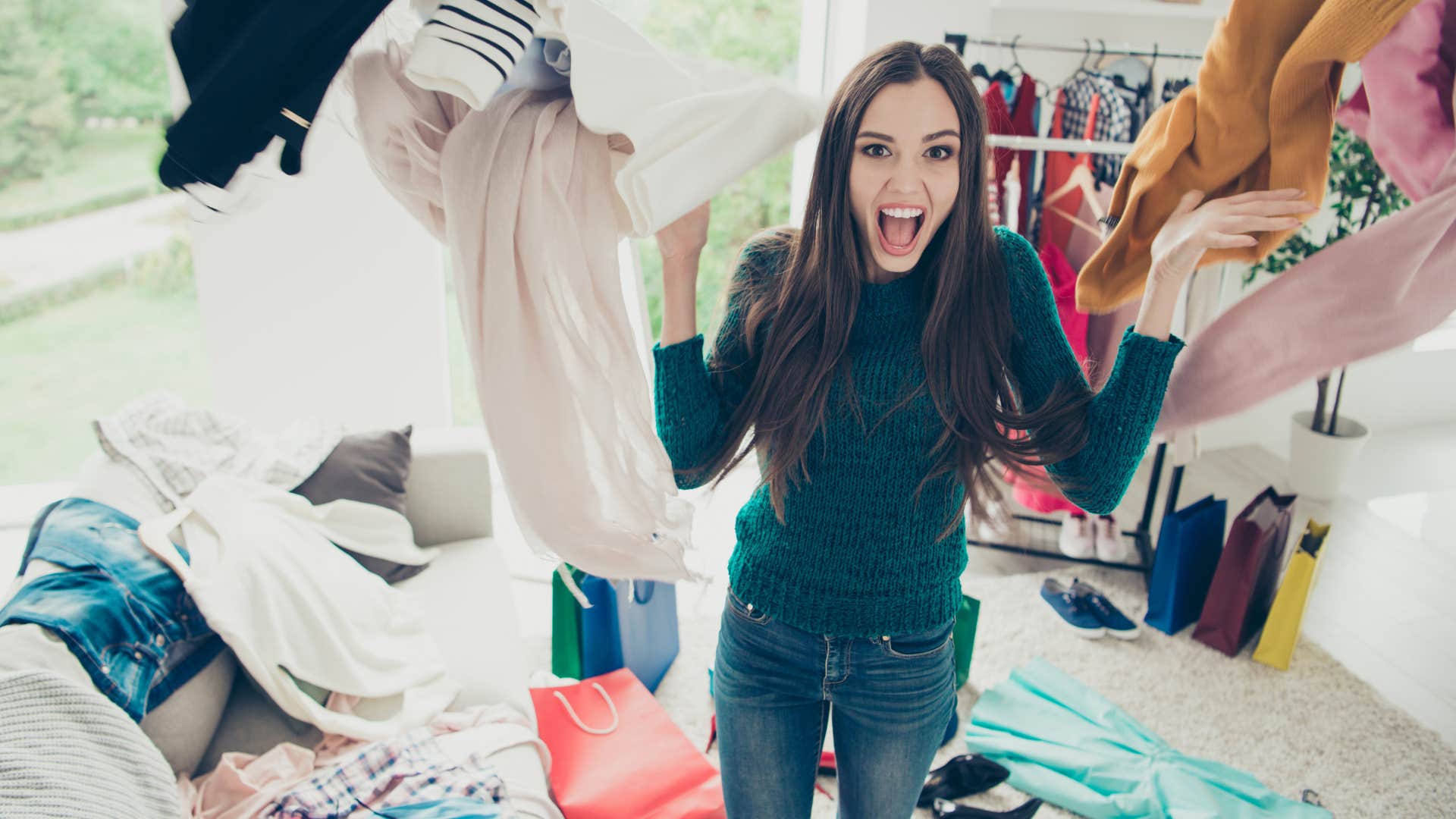 messy woman looking through her wardrobe