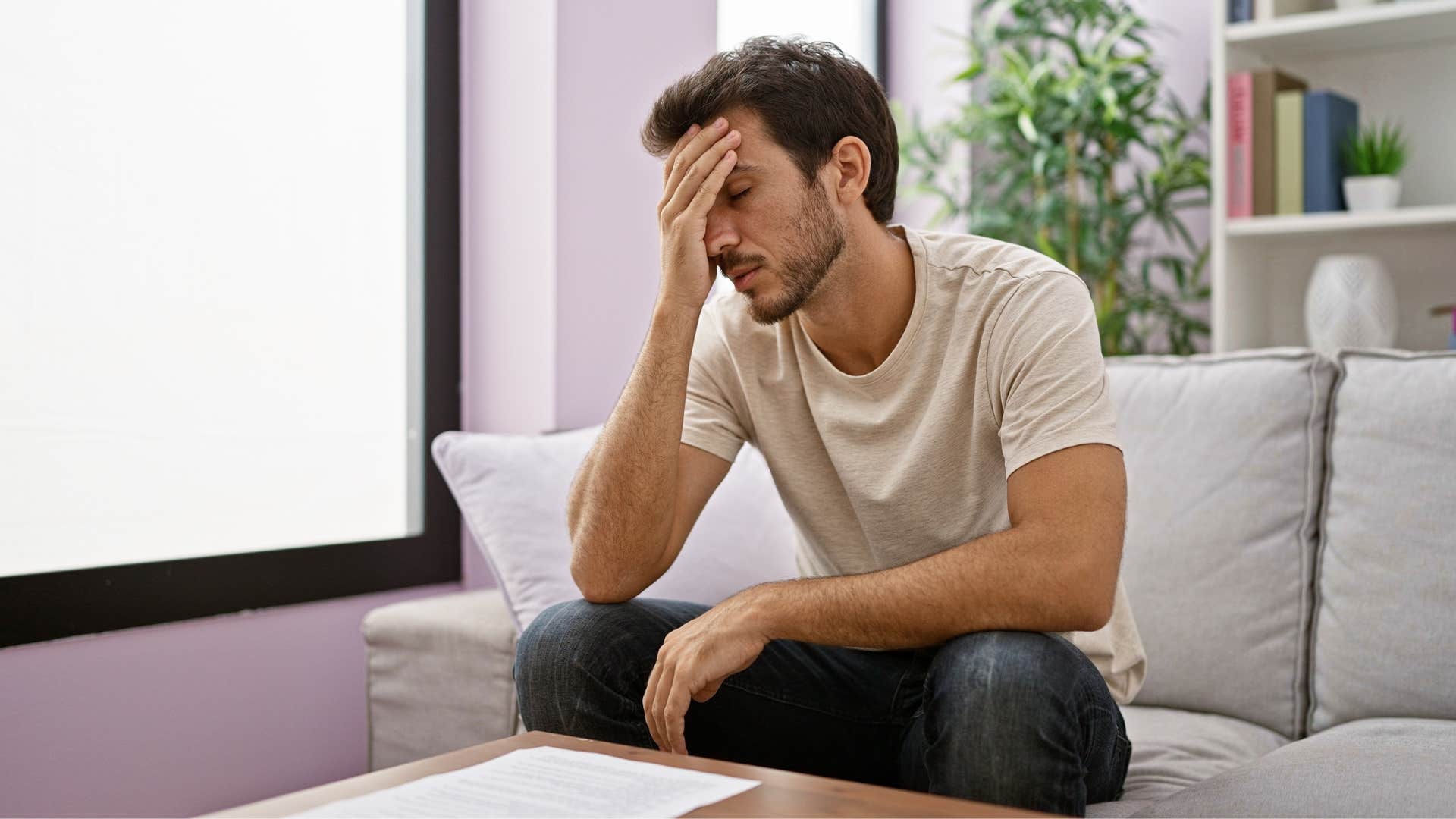 man thinking about someone who is talking about him