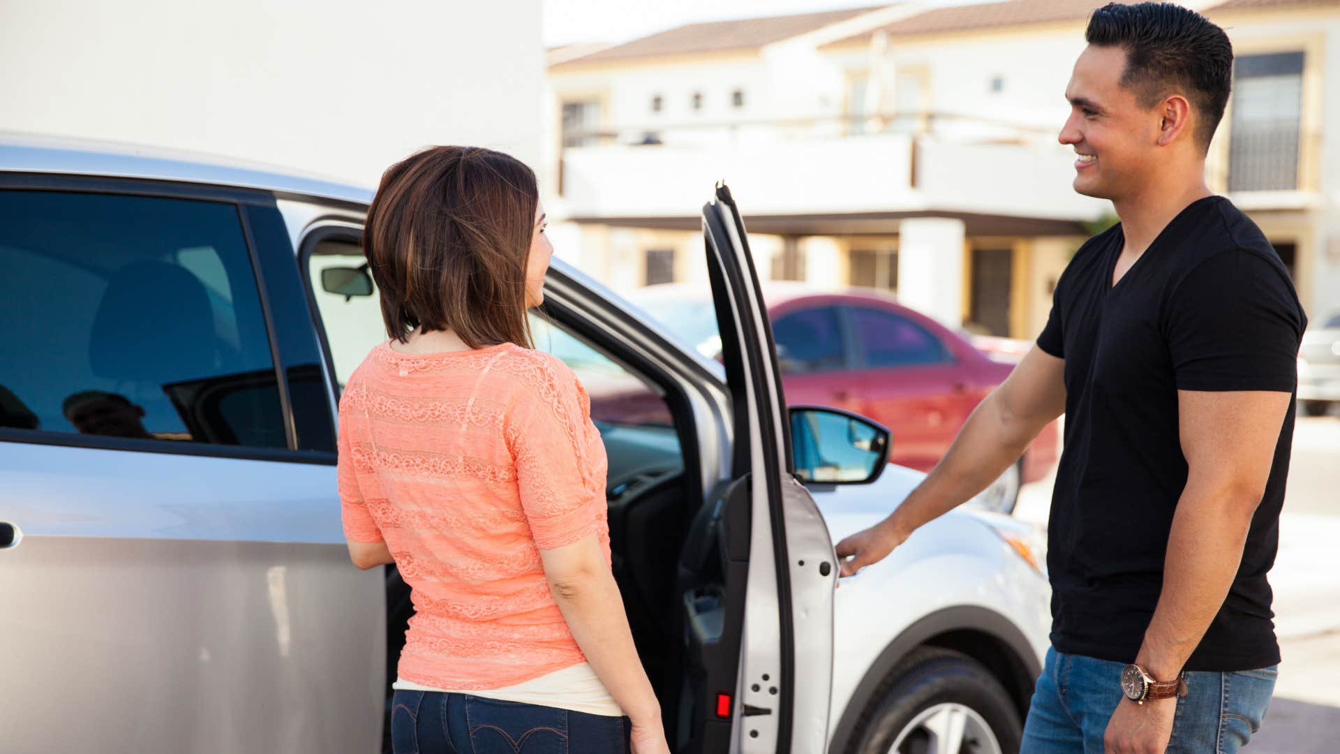 truly noble man opening car door for woman