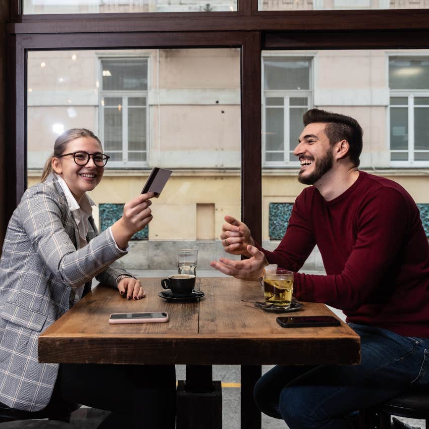 woman making man feel deeply valued by picking up the tab