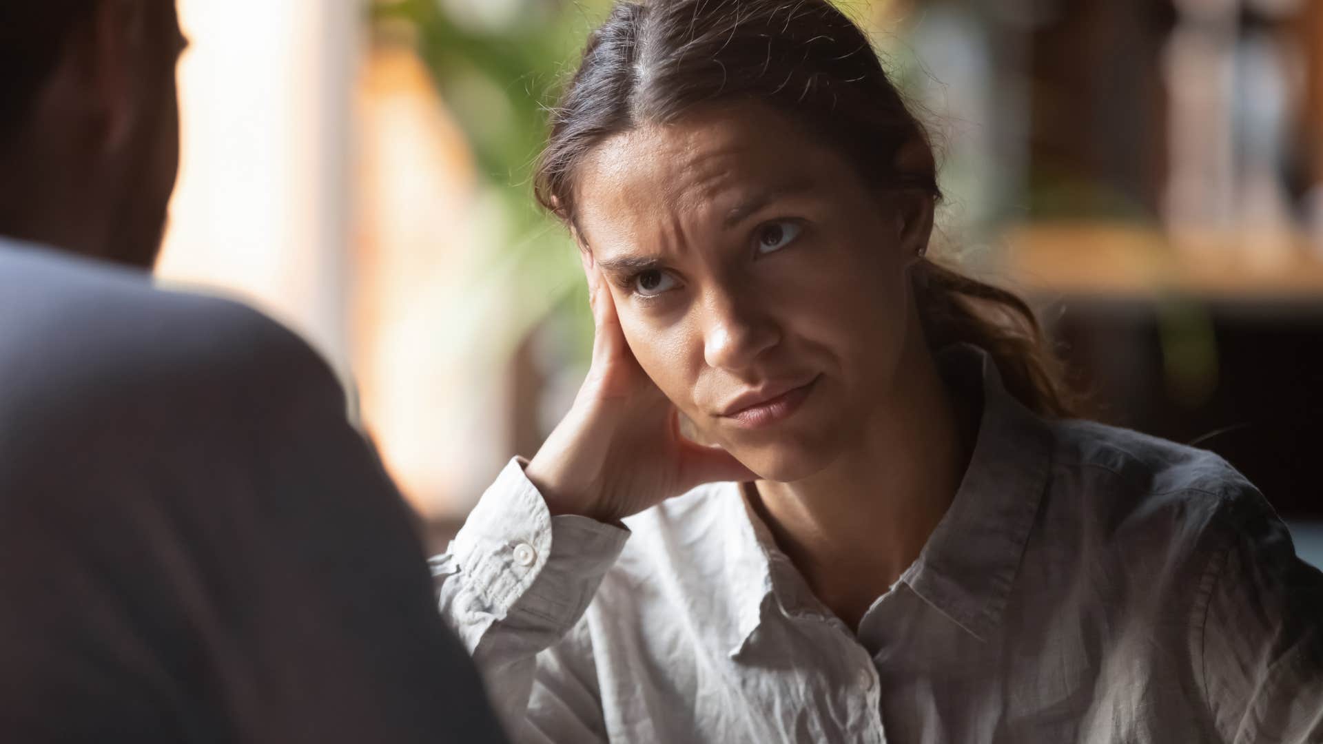Woman one-upping in conversations with a friend.