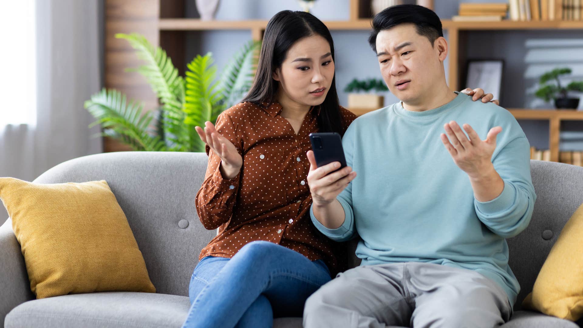 man in blue shirt sitting down in disbelief as his partner's ex follows him on social media