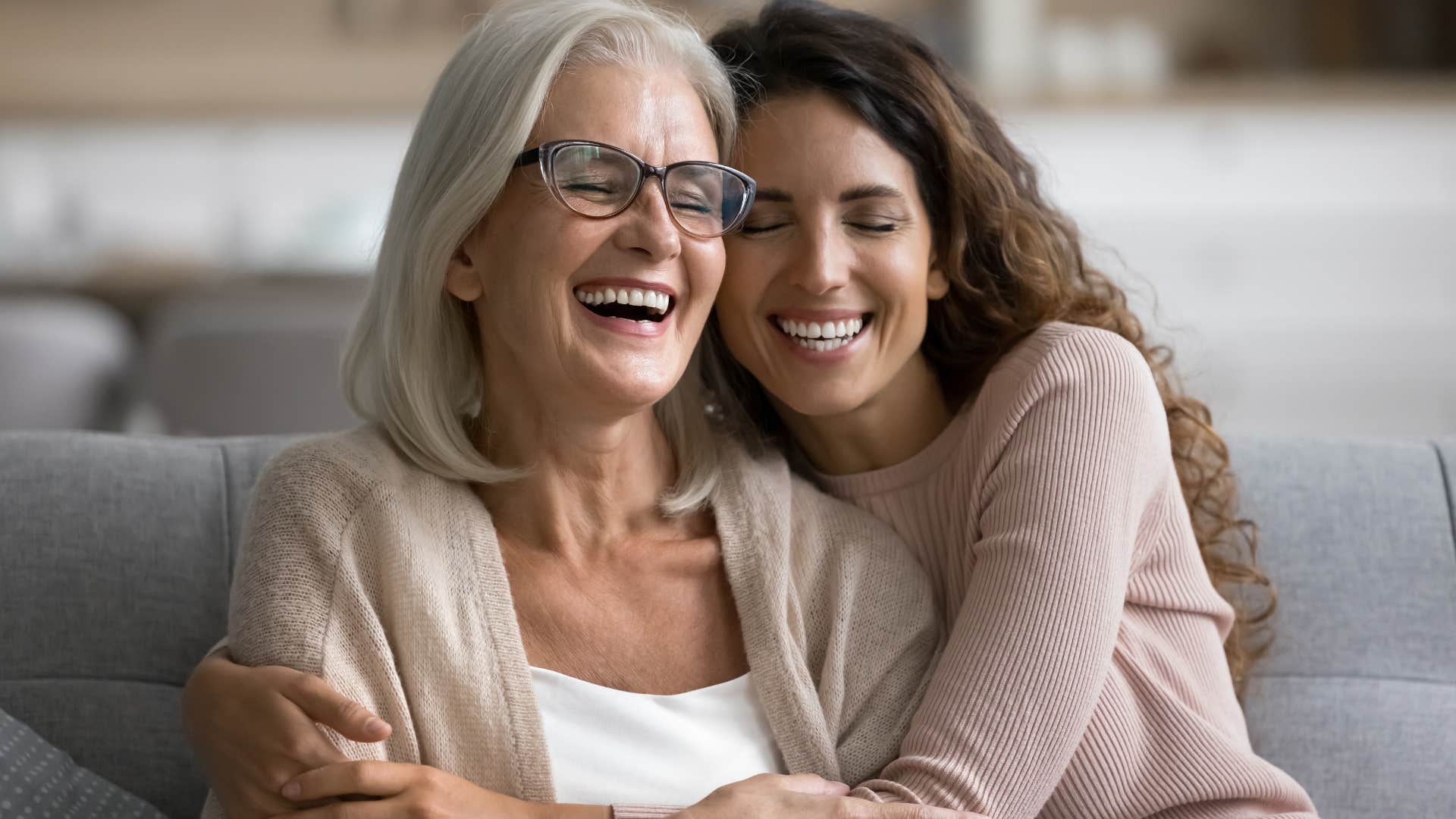 confident woman hugging mom laughing