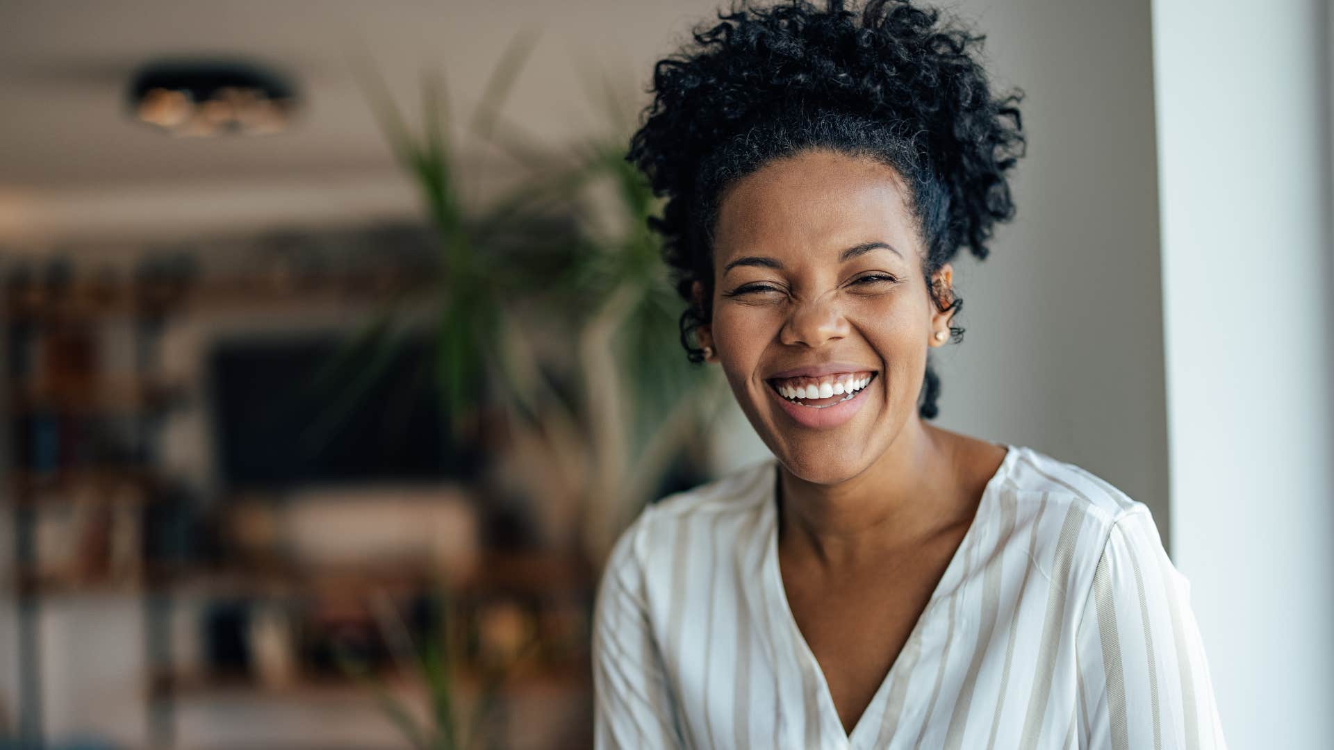 woman who feels seen and heard smiling