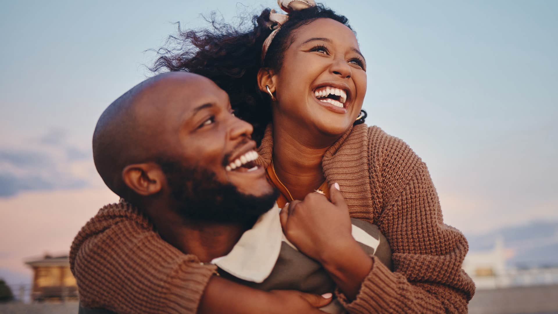 man hugging partner excited by her success