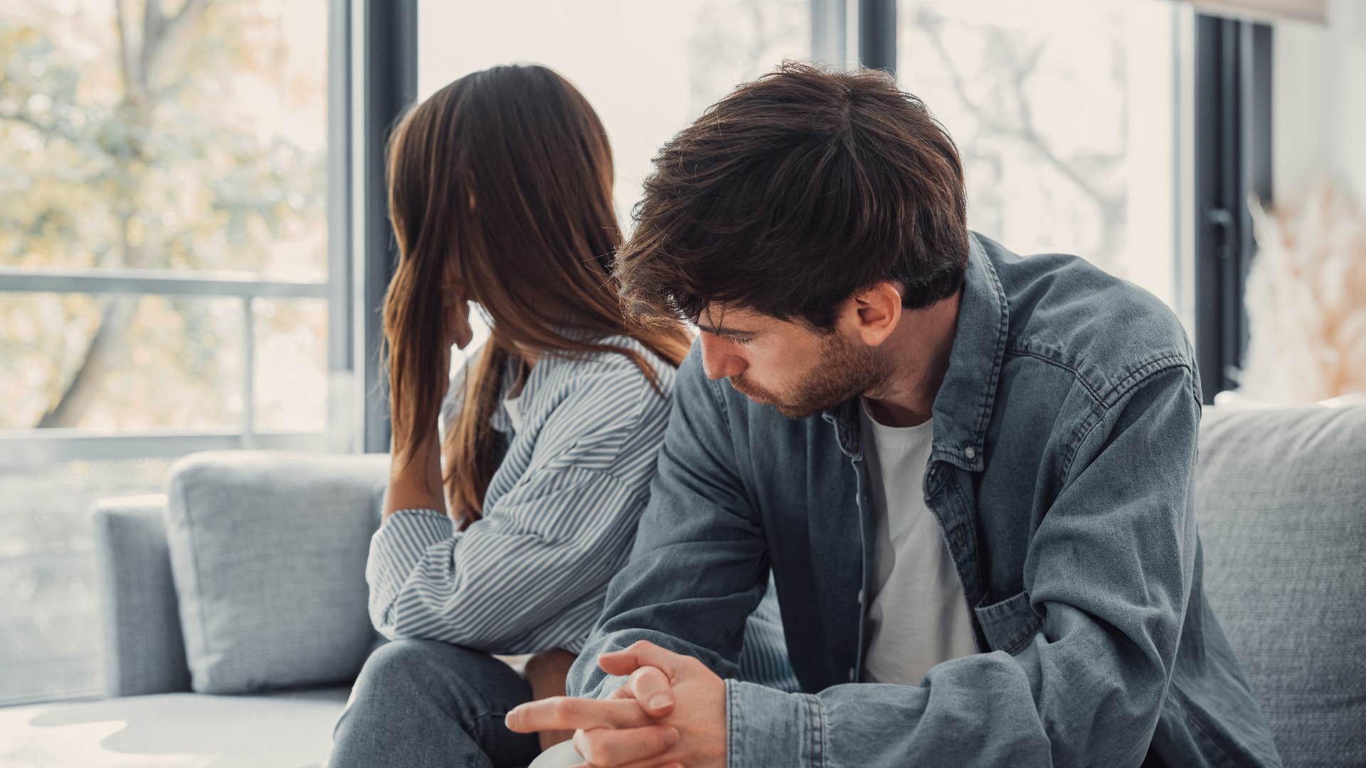 woman chipping away at man's confidence by acting as his mother