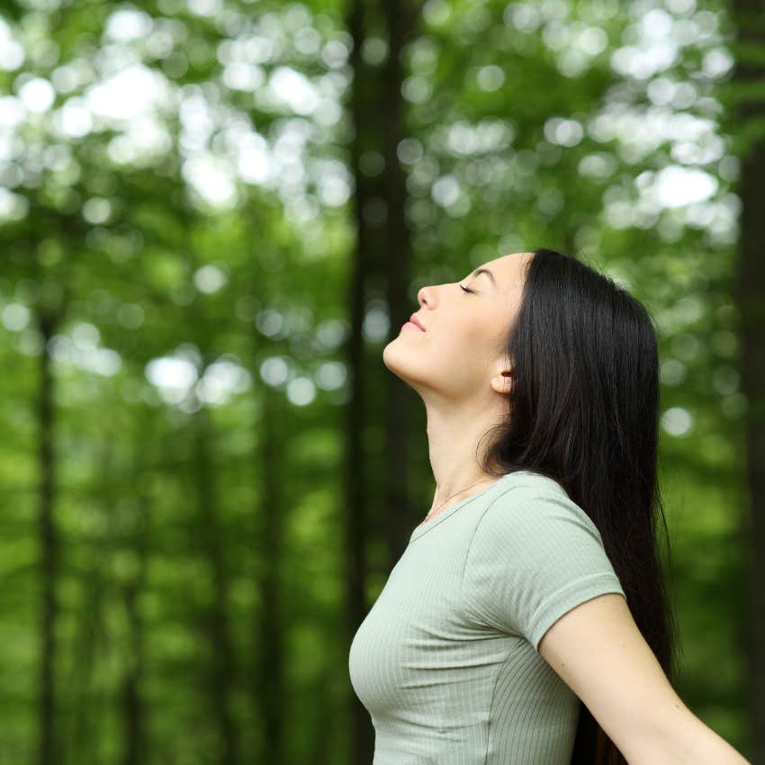 woman breathing deeply as vacation for her brain